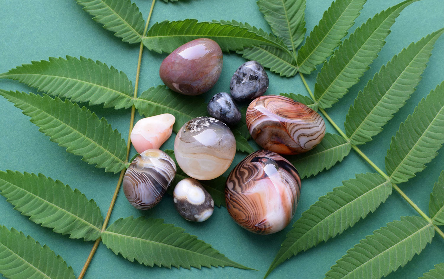 Sardonyx gemstone with bands of red and white displaying a layered appearance and smooth polished surface
