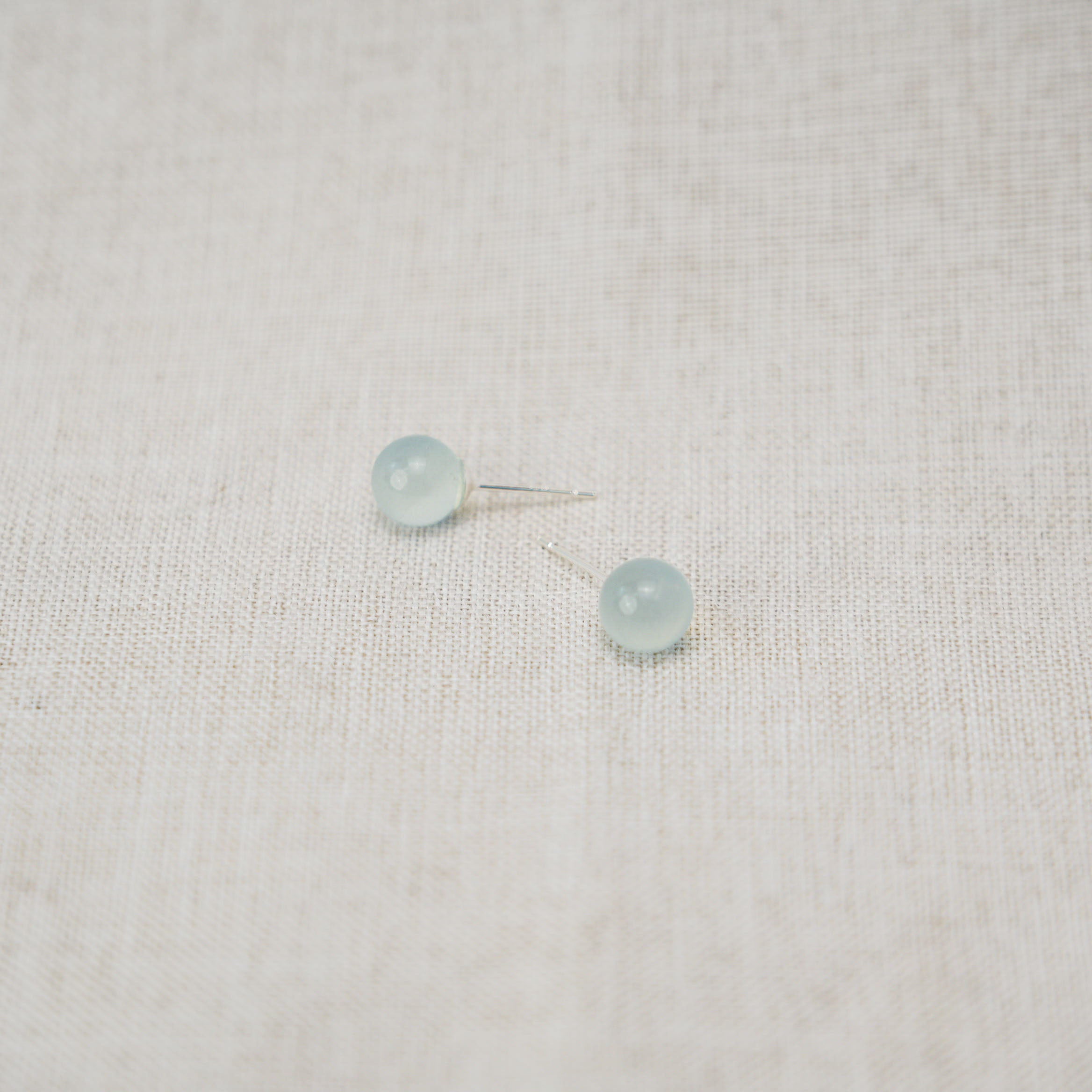 Handcrafted aquamarine earrings set in sterling silver offer a touch of sophistication.