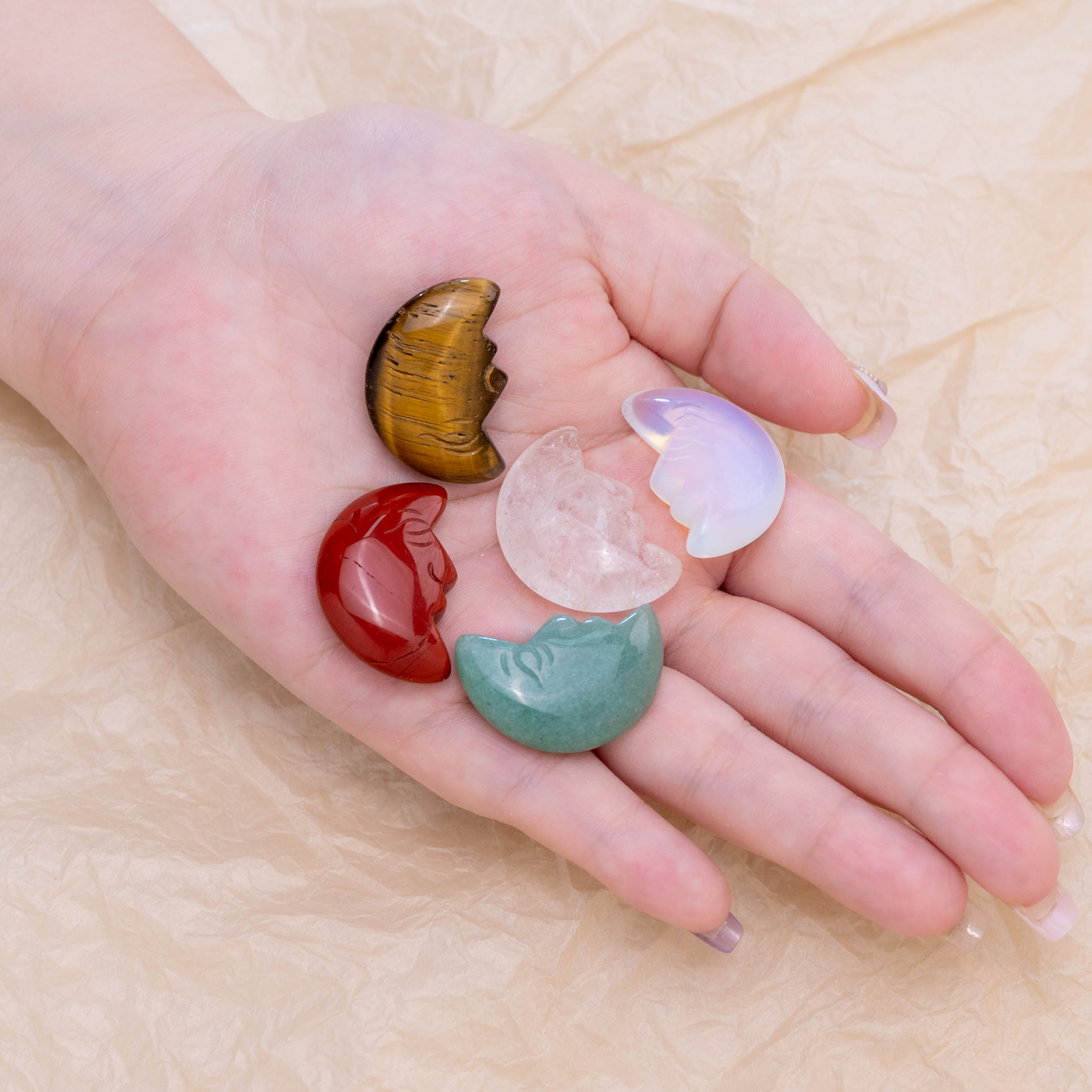 The Green Aventurine Mini Moonface serves as a powerful talisman.