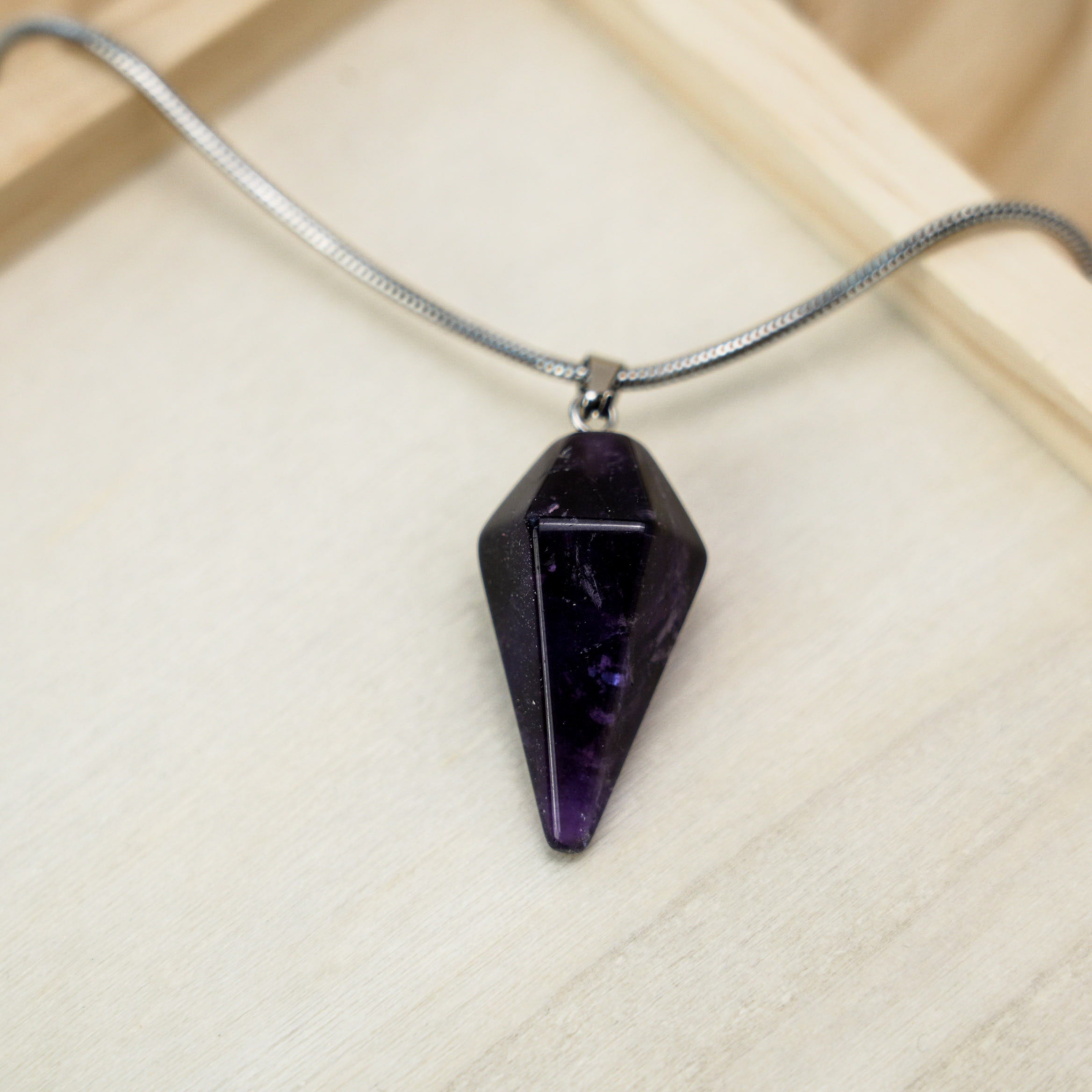 A beautiful amethyst pendant set in sterling silver, perfect for adding a touch of elegance to any outfit.