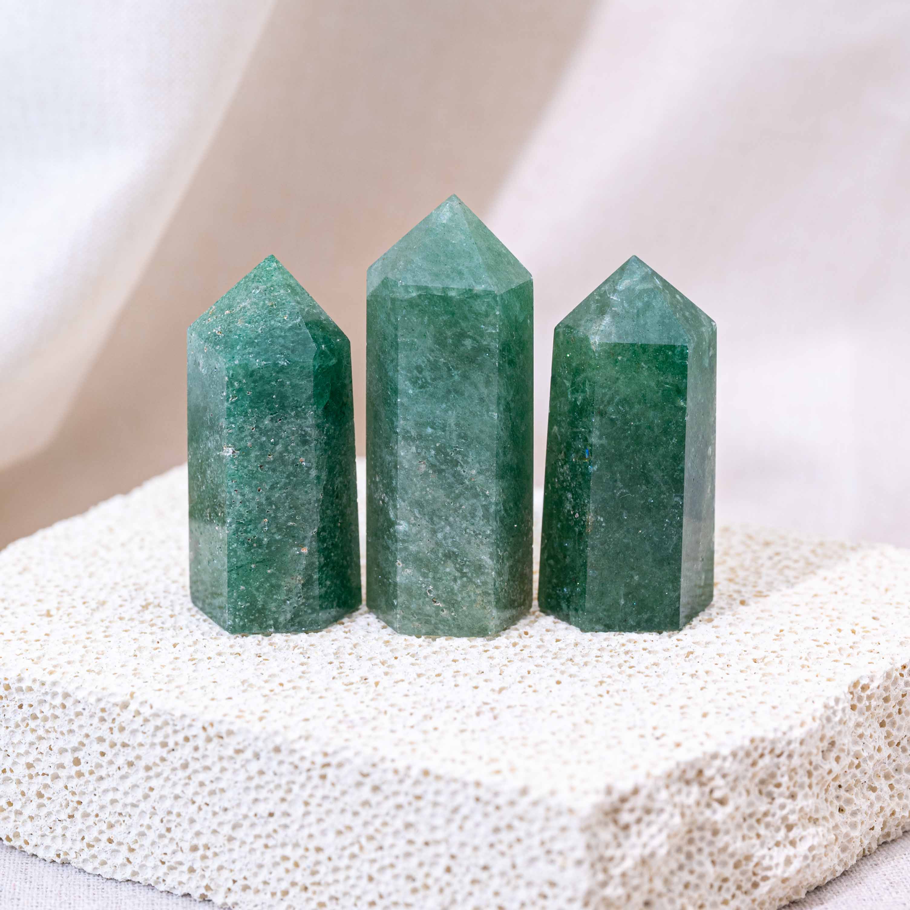 Crystal point highlighting the natural beauty of Green Strawberry Quartz.