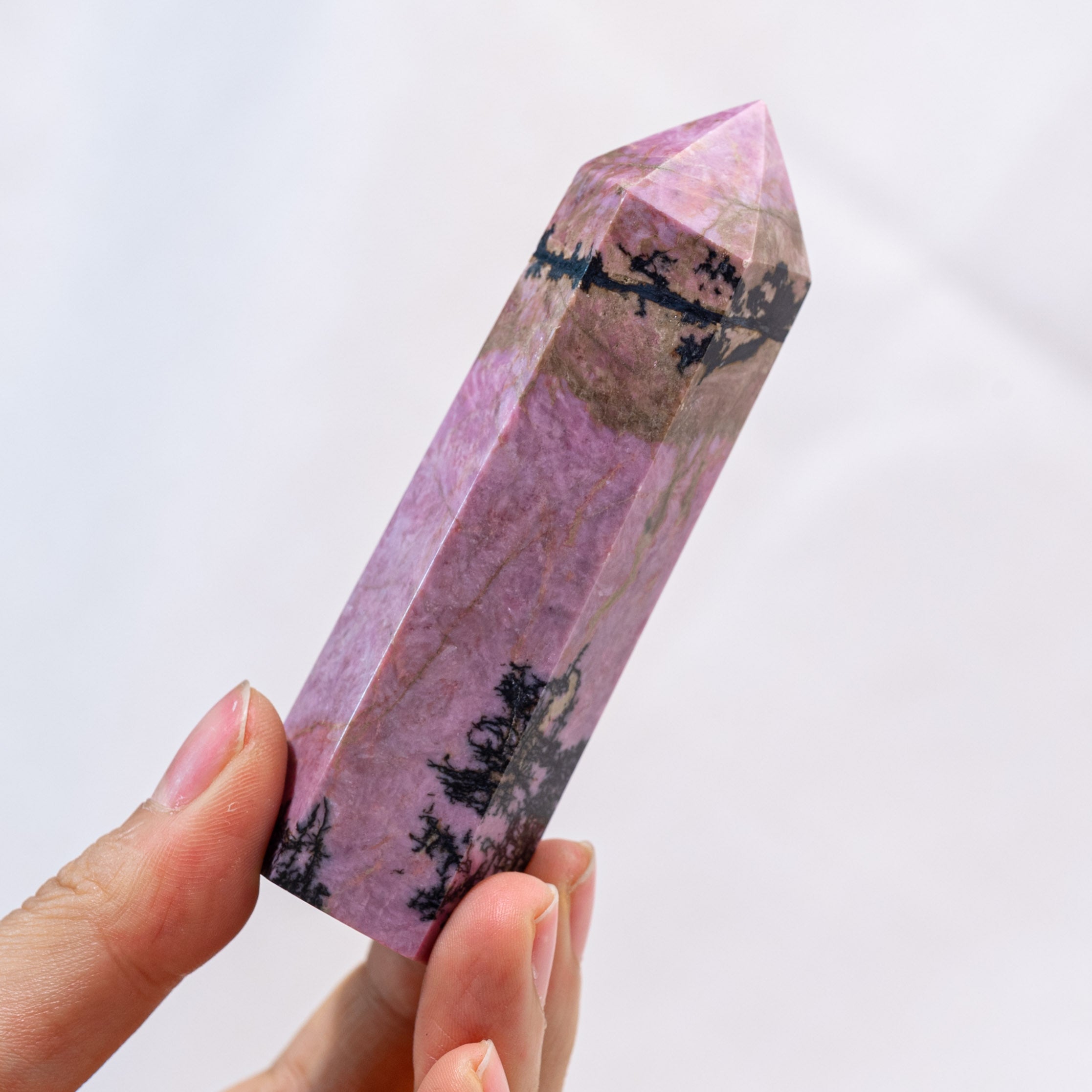 High-quality Pink Rhodonite Point for crystal healing.