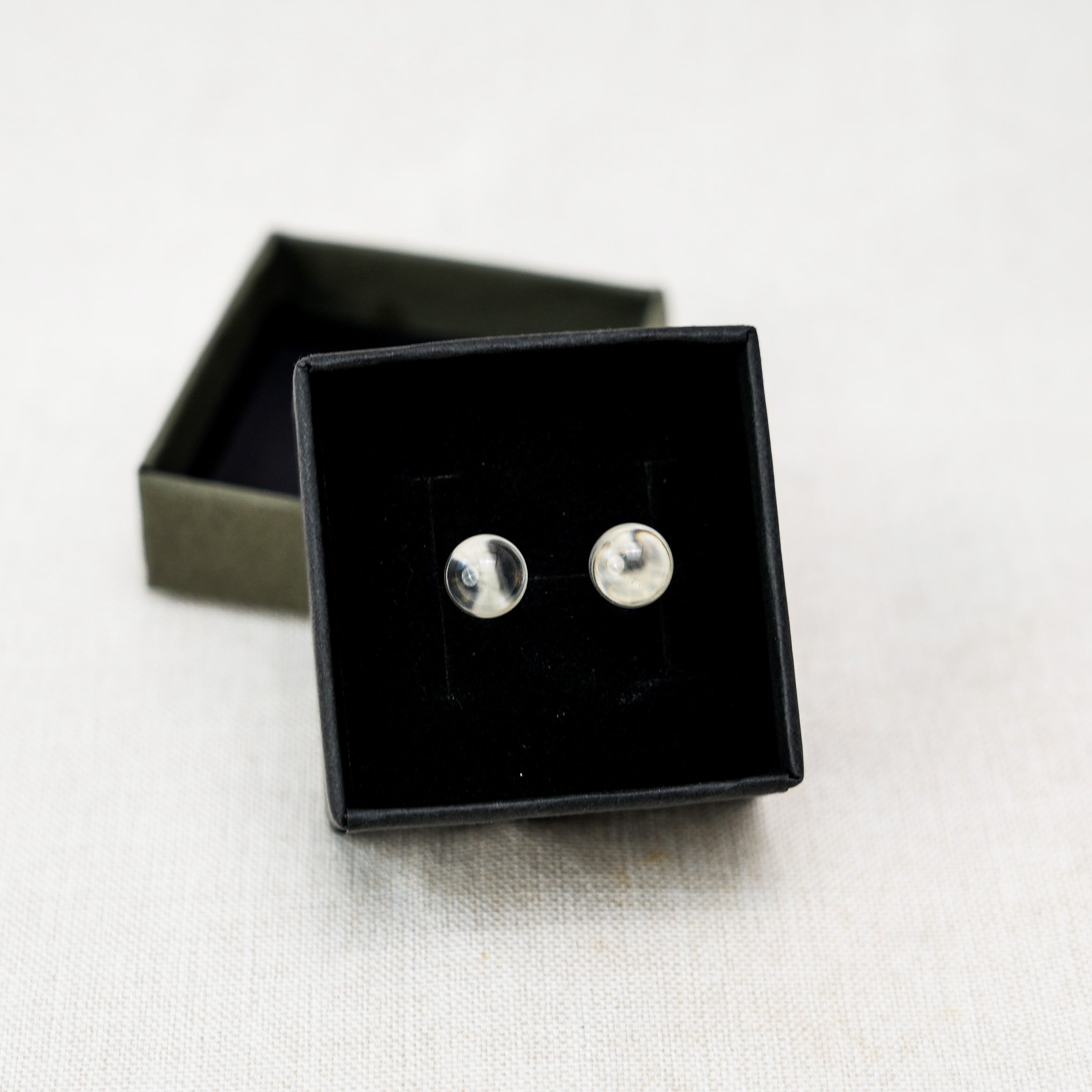 Delicate clear quartz teardrop earrings that enhance your look with their timeless appeal.
