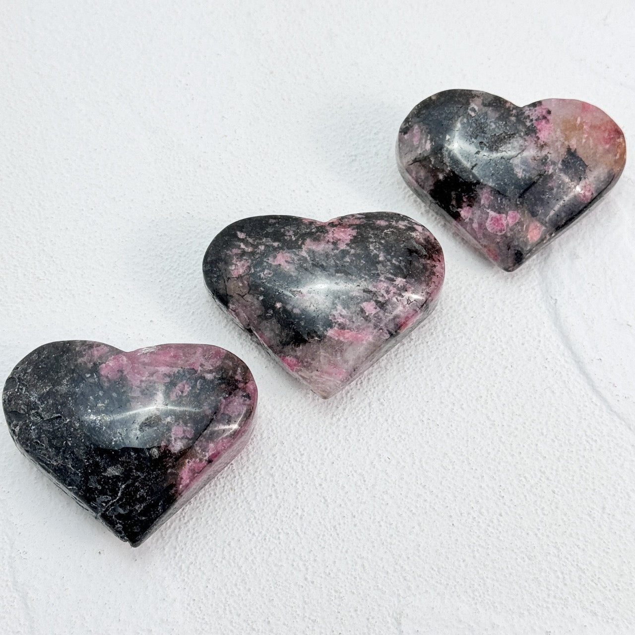 passionate heart-shaped black rhodonite charm