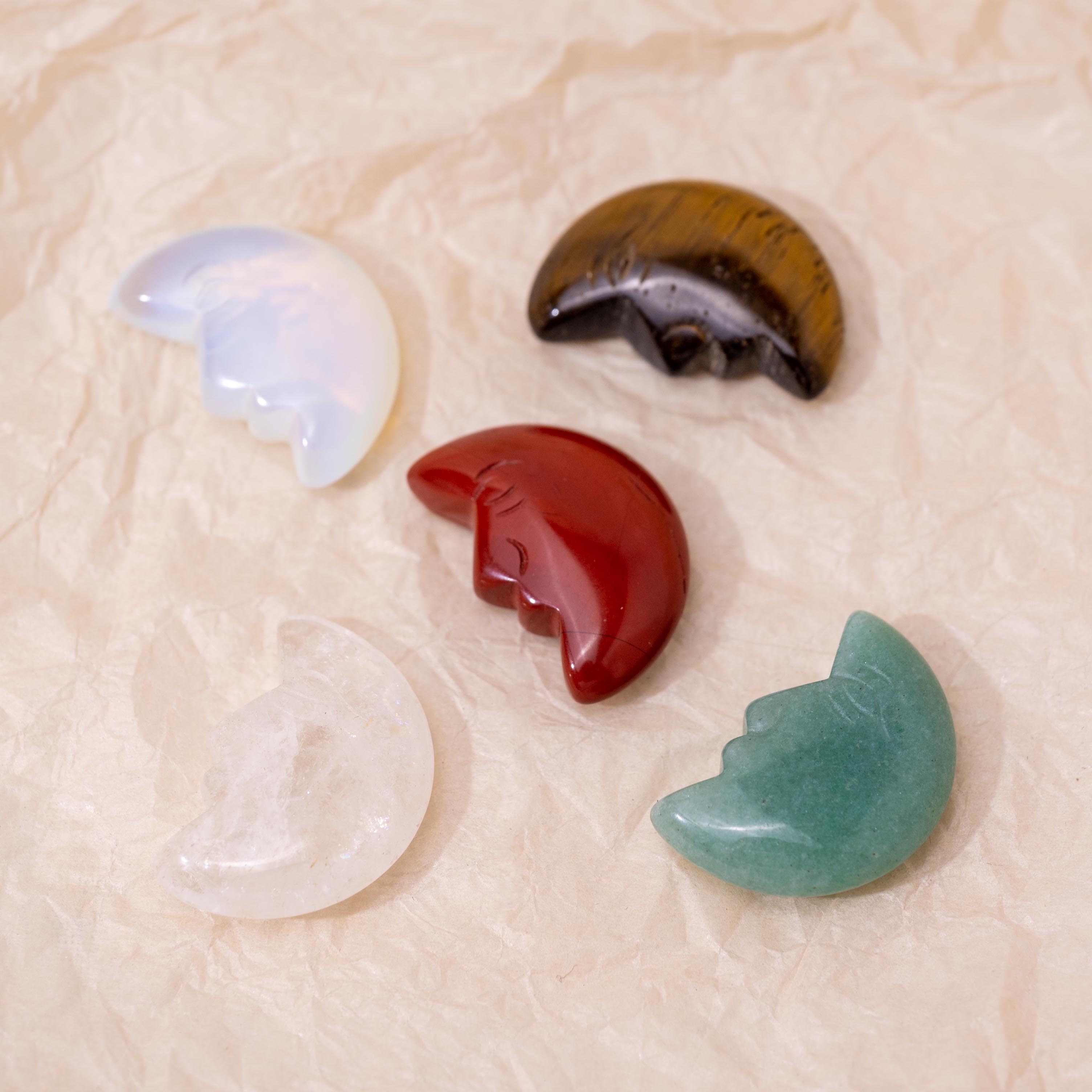 The Green Aventurine Mini Moonface offers calming energy.