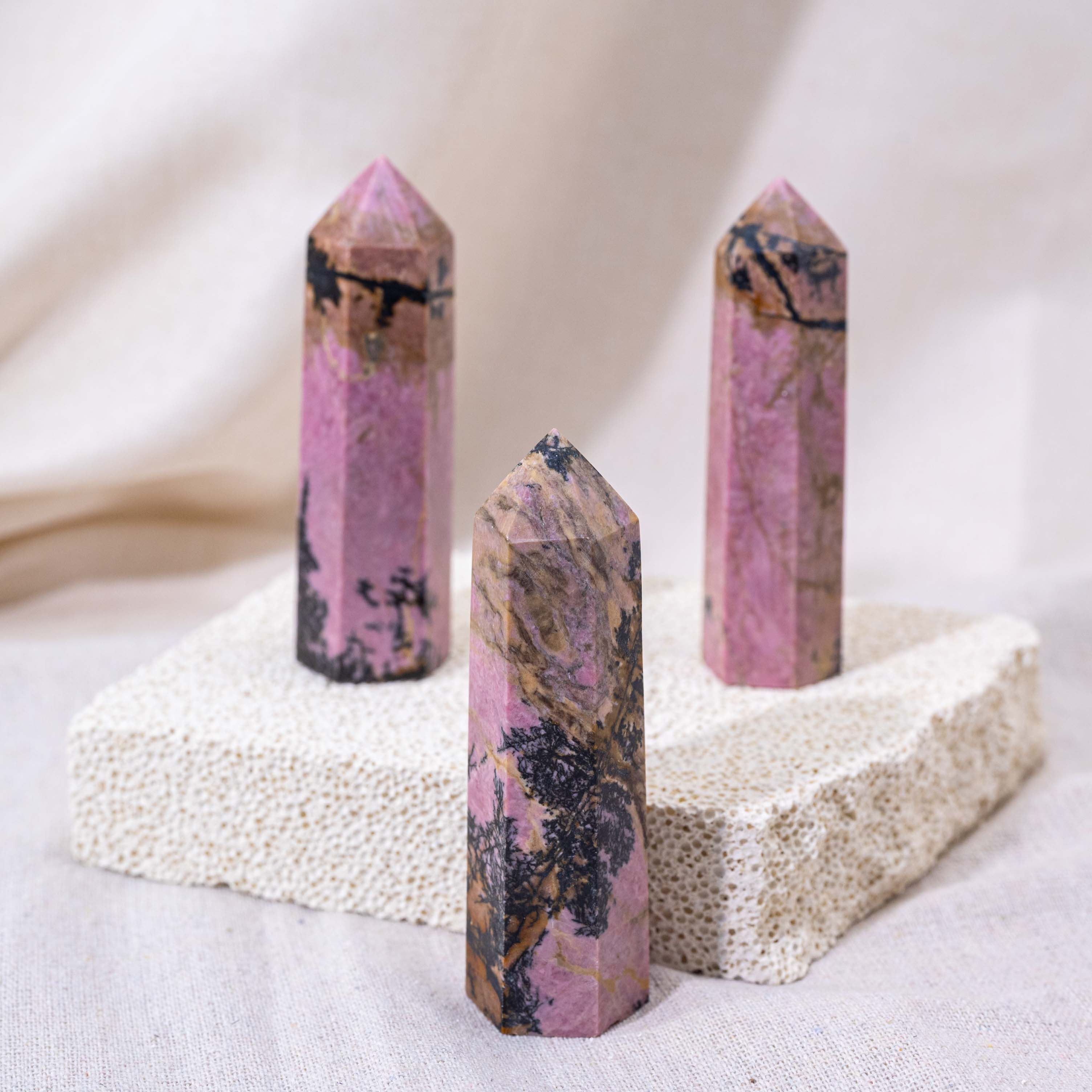 Stunning Pink Rhodonite Point, showcasing natural beauty.