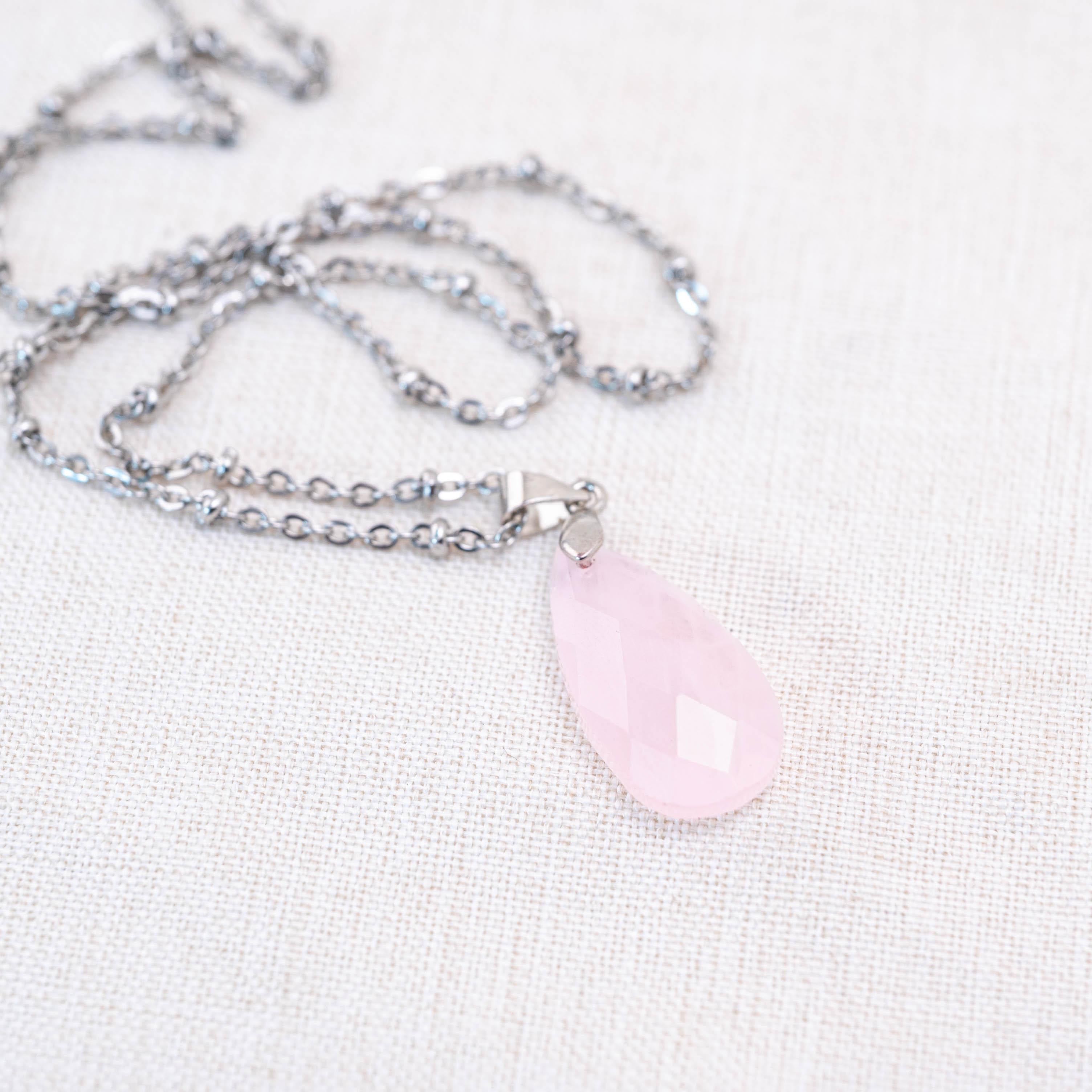 The Rose Quartz Pendant's soft pink hue and elegant design highlight its natural beauty.