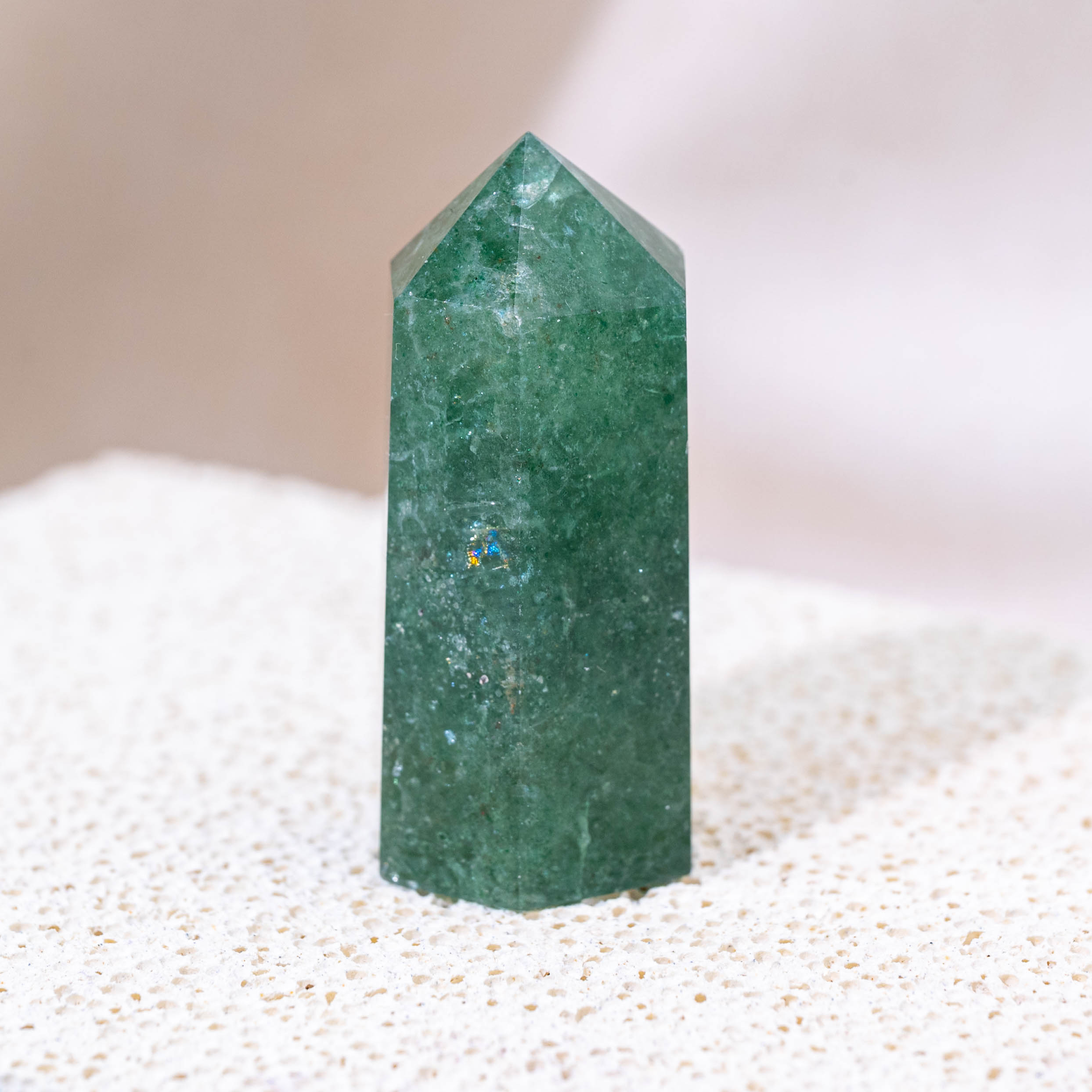 A stunning Green Strawberry Quartz Point for heart chakra balance.