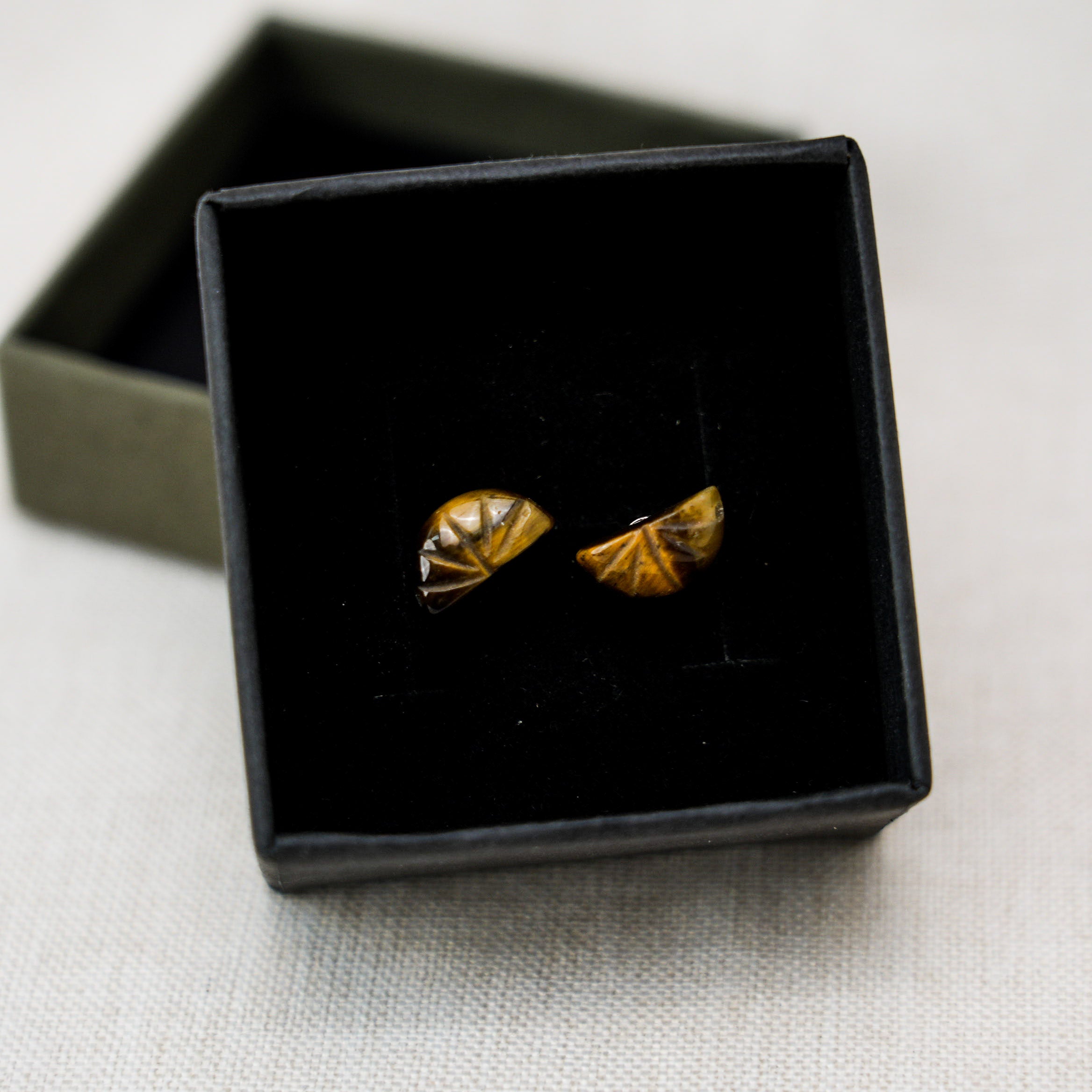 Beautiful tiger eye stone drop earrings that add a touch of elegance and charm to any ensemble.