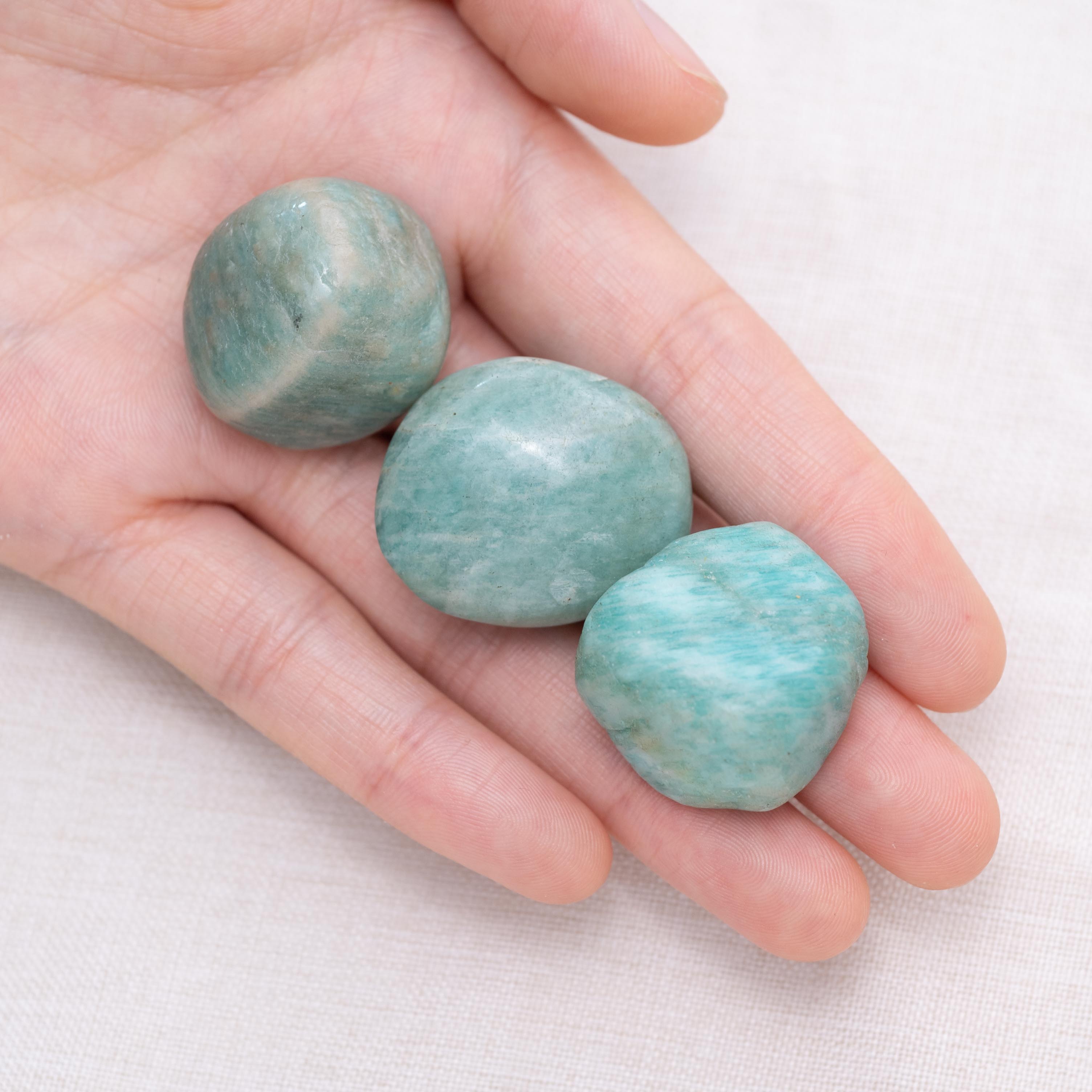Displayed Amazonite tumbled stones for peaceful energy