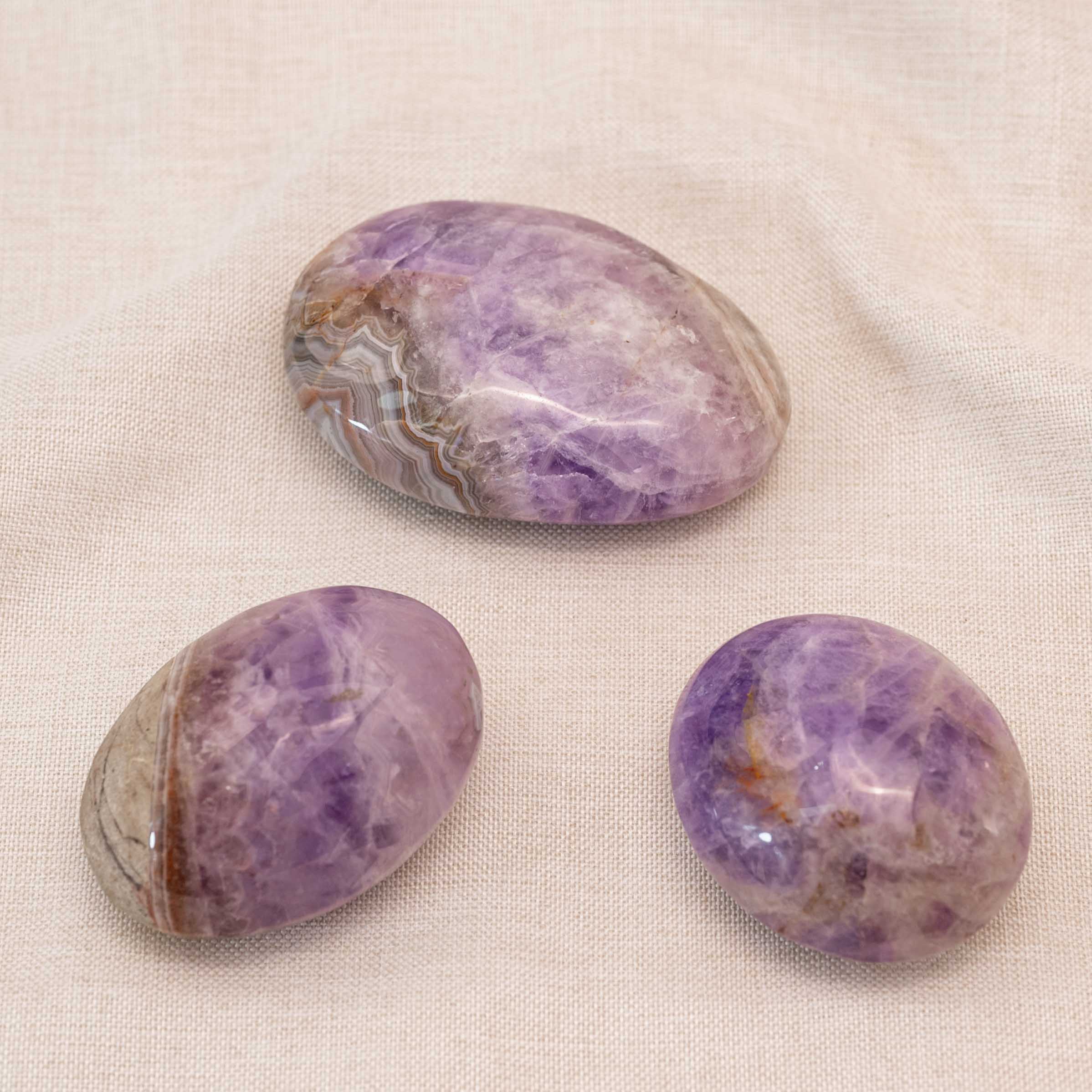 Amethyst Agate Palm Stone showcasing stunning purple layers and textures
