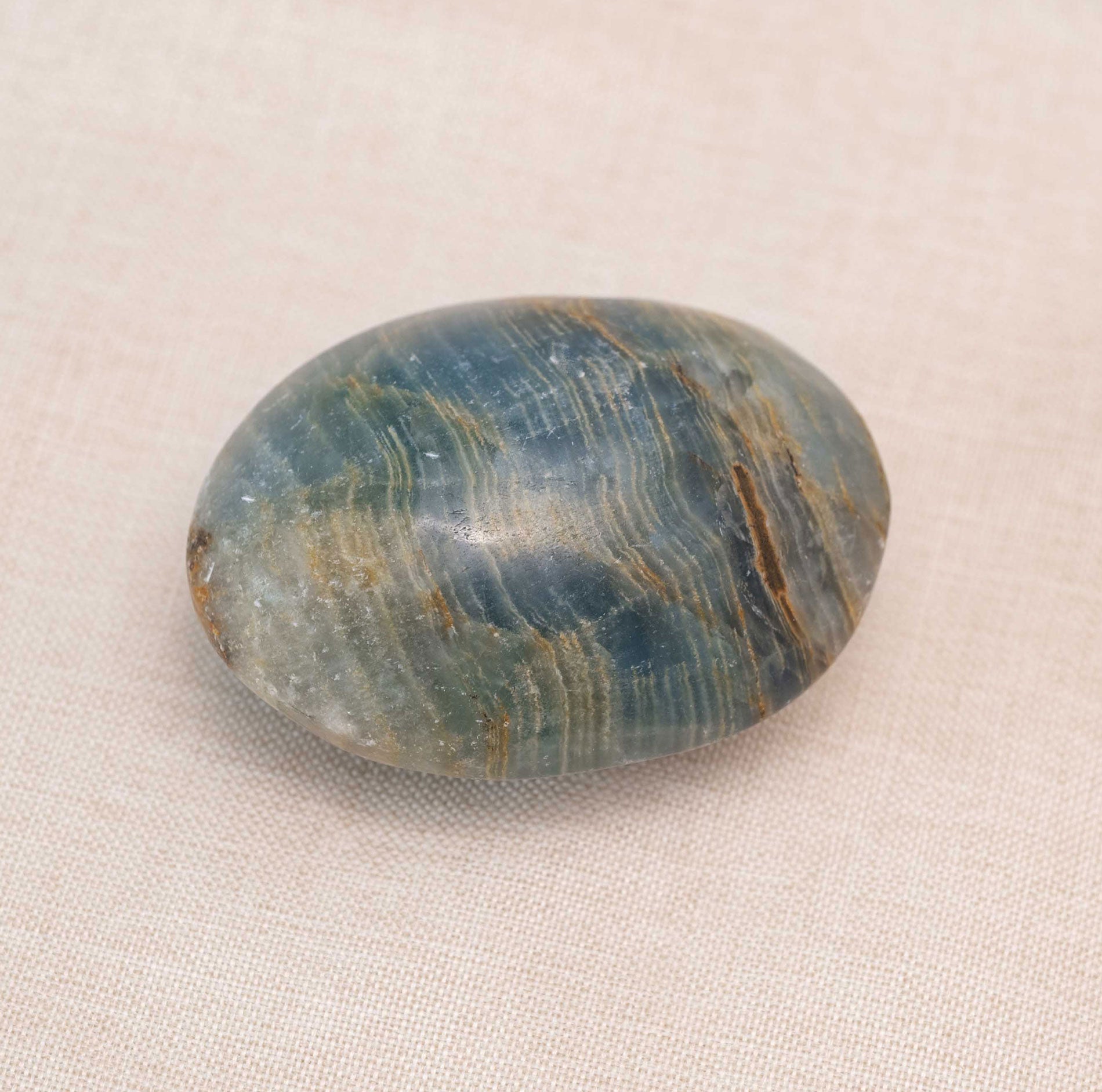 Blue Onyx Palm Stone with deep blue hues and natural patterns