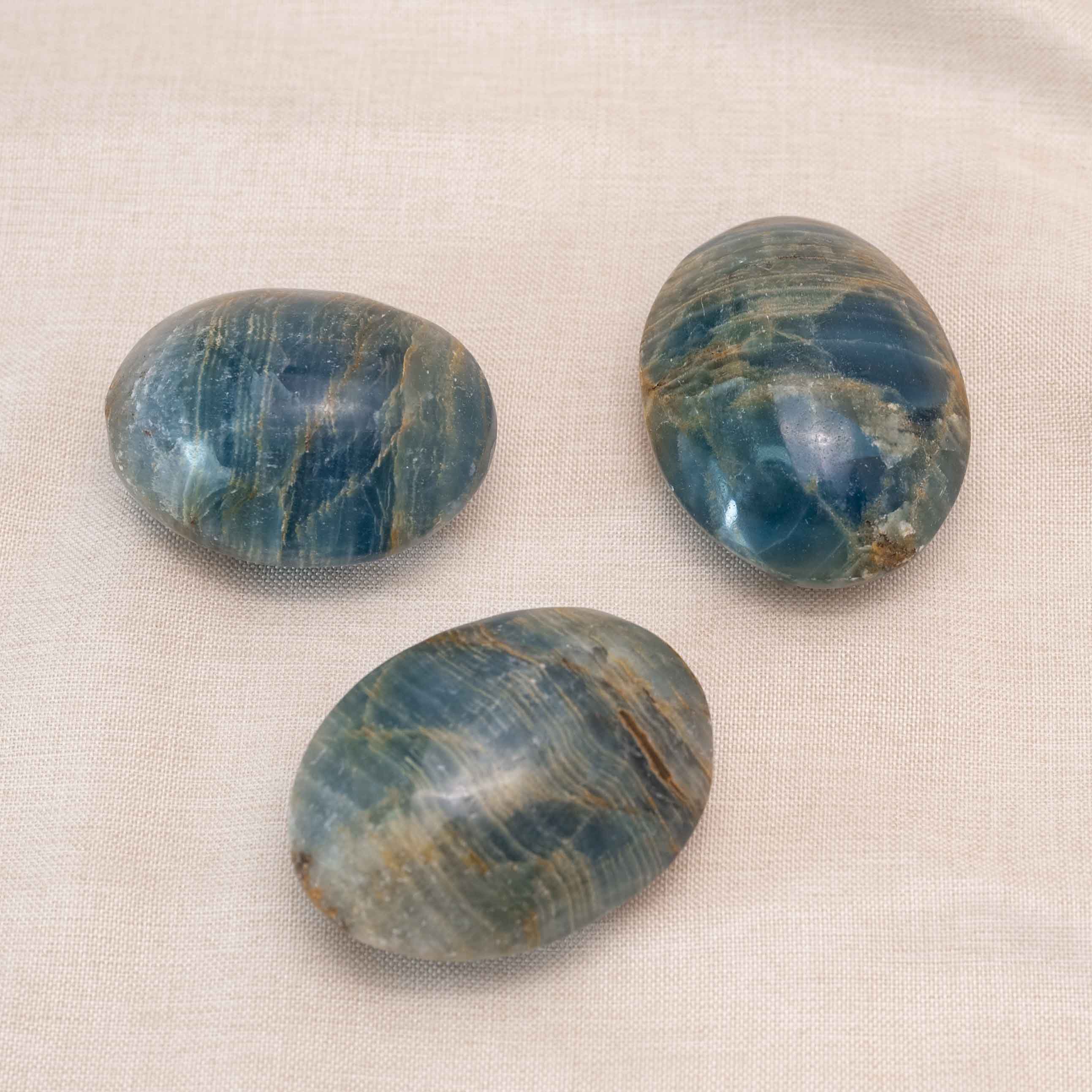 Blue Onyx Palm Stone showcasing stunning blue layers and textures