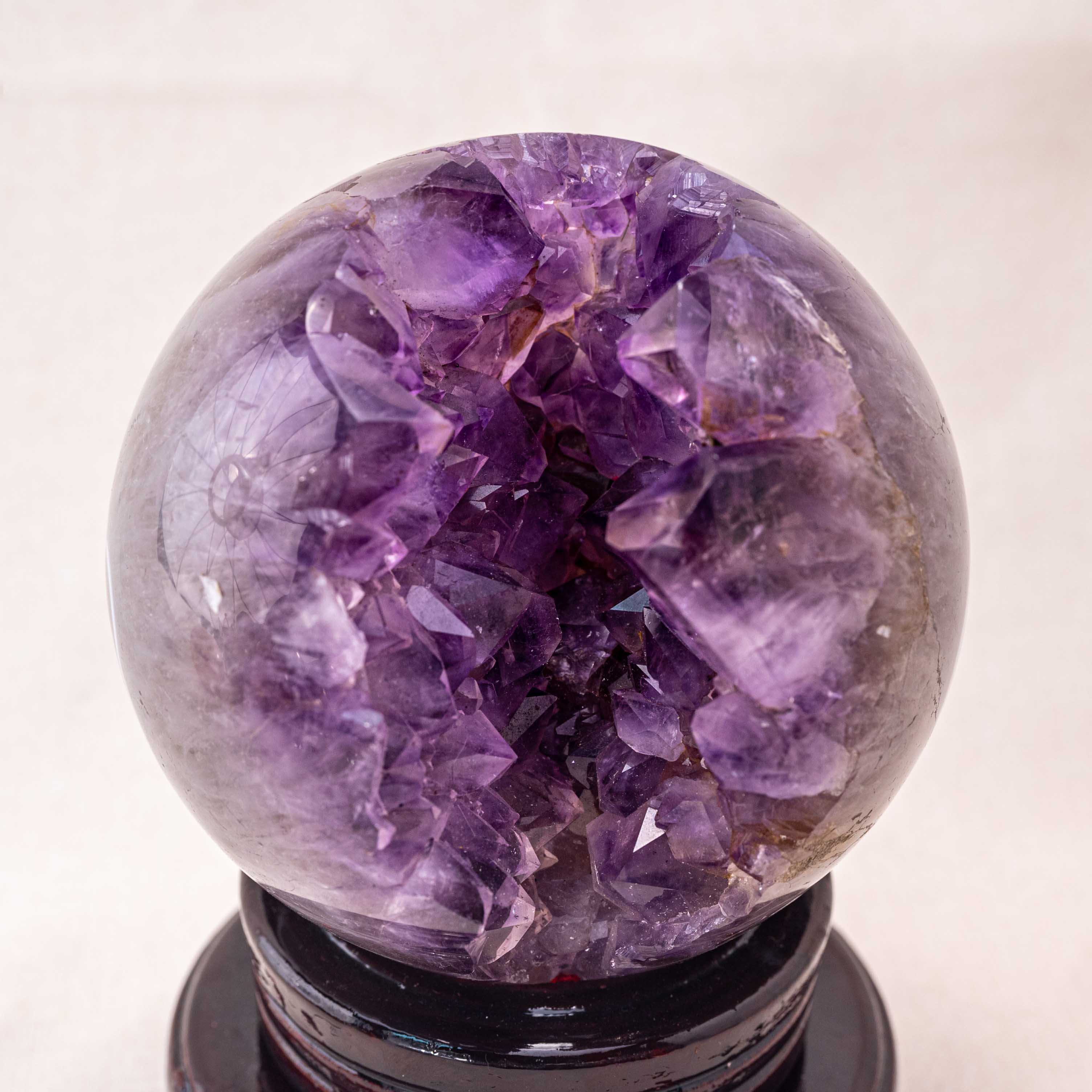 Amethyst crystal sphere with a natural cluster, ideal for spiritual healing