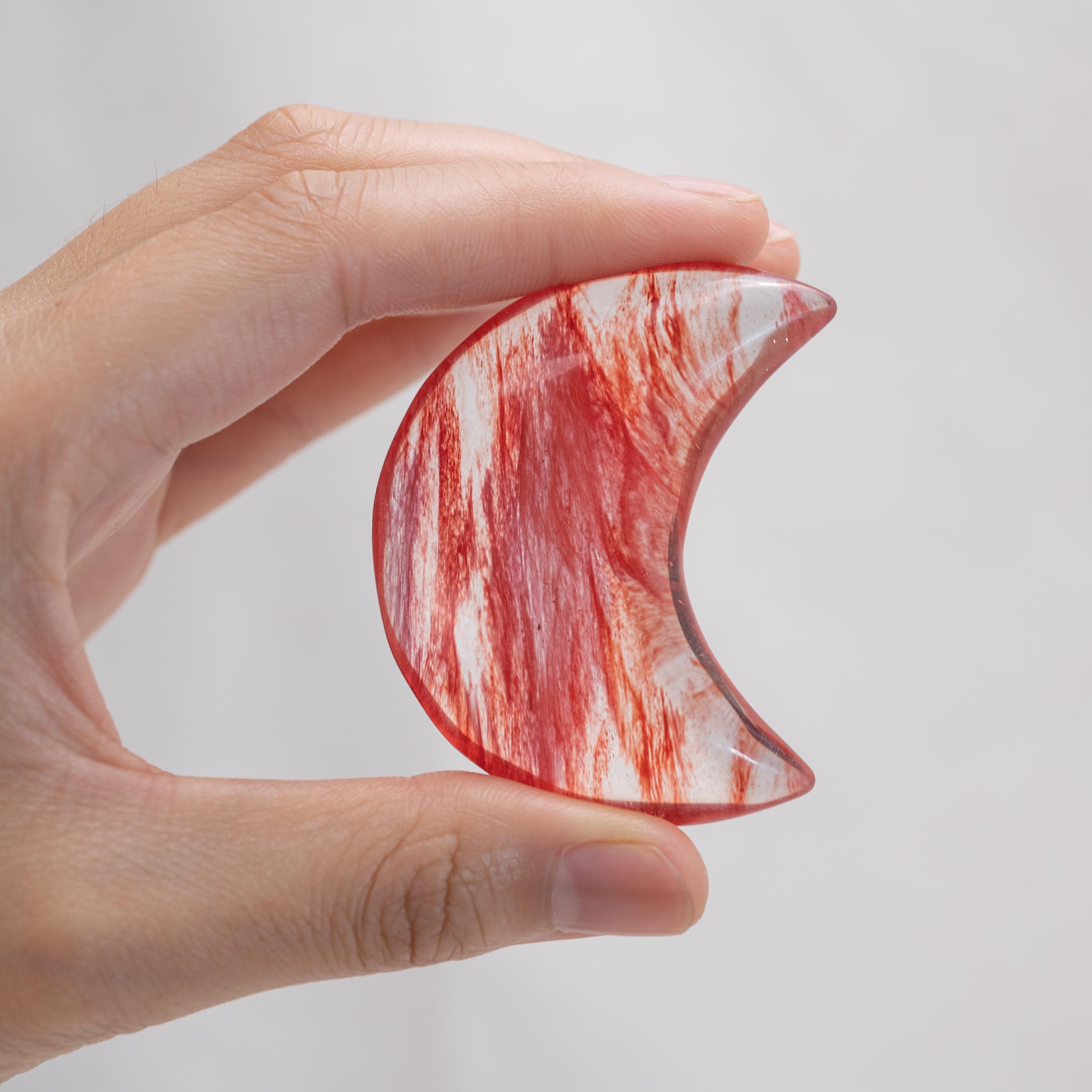 Detailed view of Red Smelting Quartz Star/Moon Palm Stone