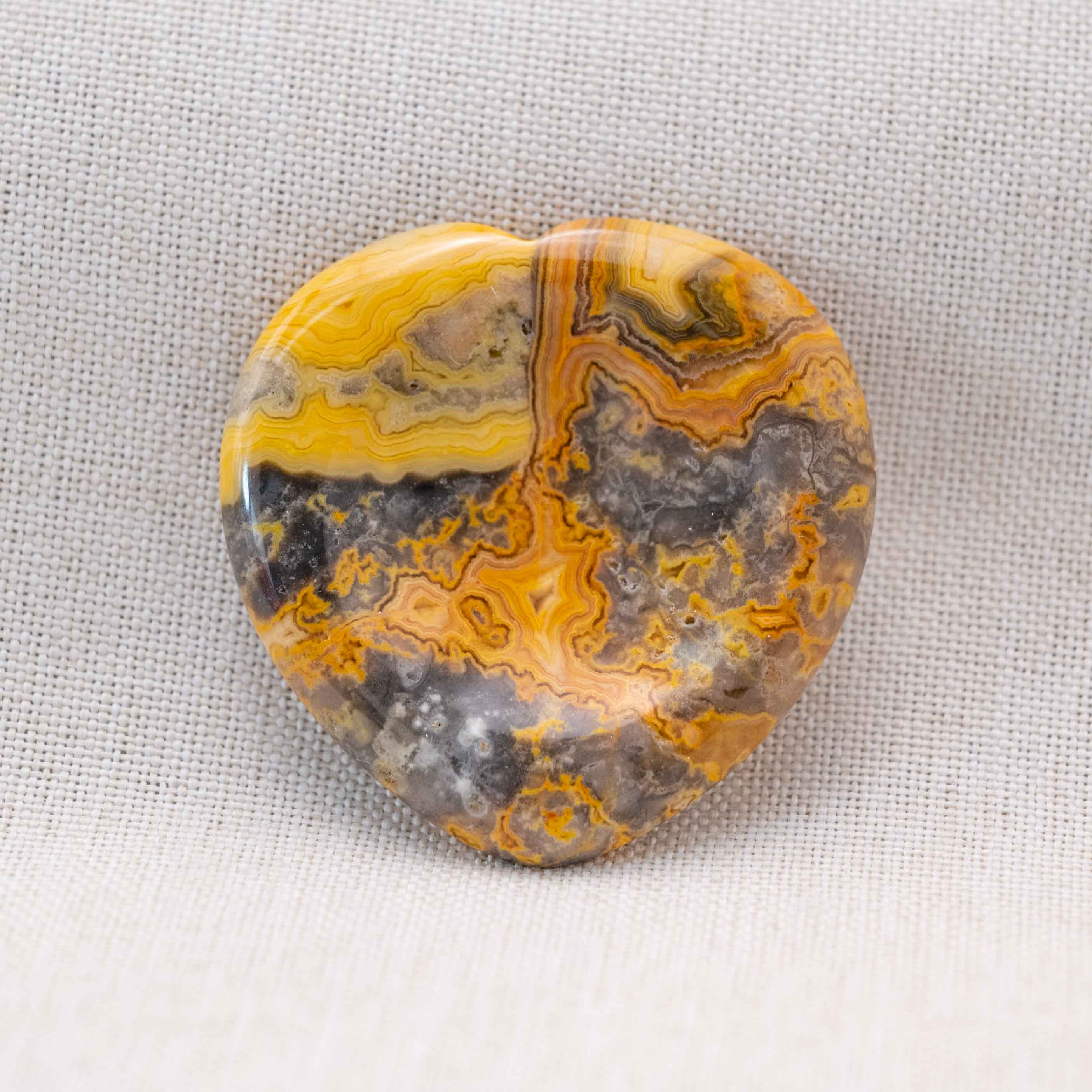 Carry the Crazy Agate Heart Worry Stone to uplift your spirits throughout the day