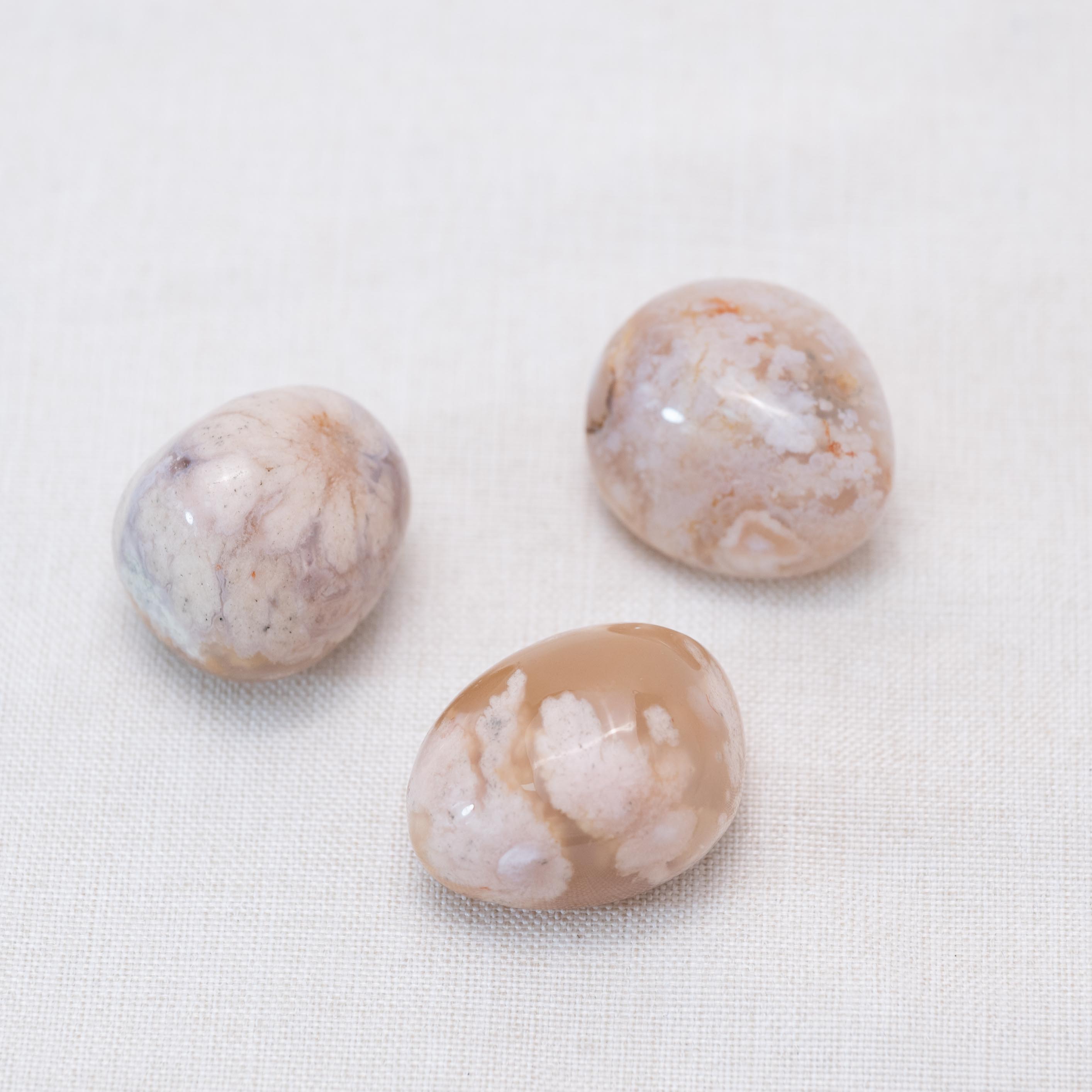 Displayed Flower Agate tumbled stones for positive transformation