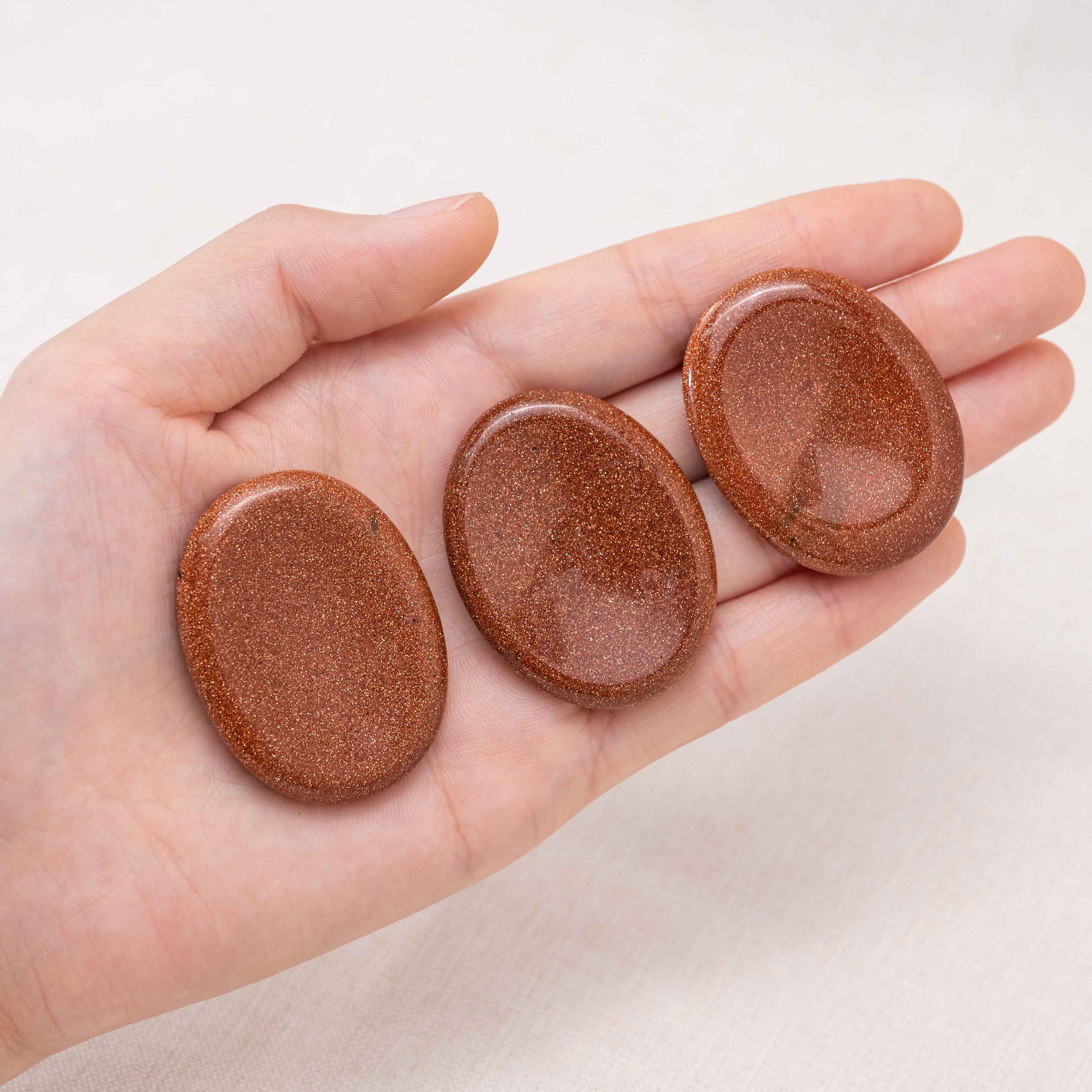 This shimmering Gold Sand Worry Stone boosts confidence and personal power