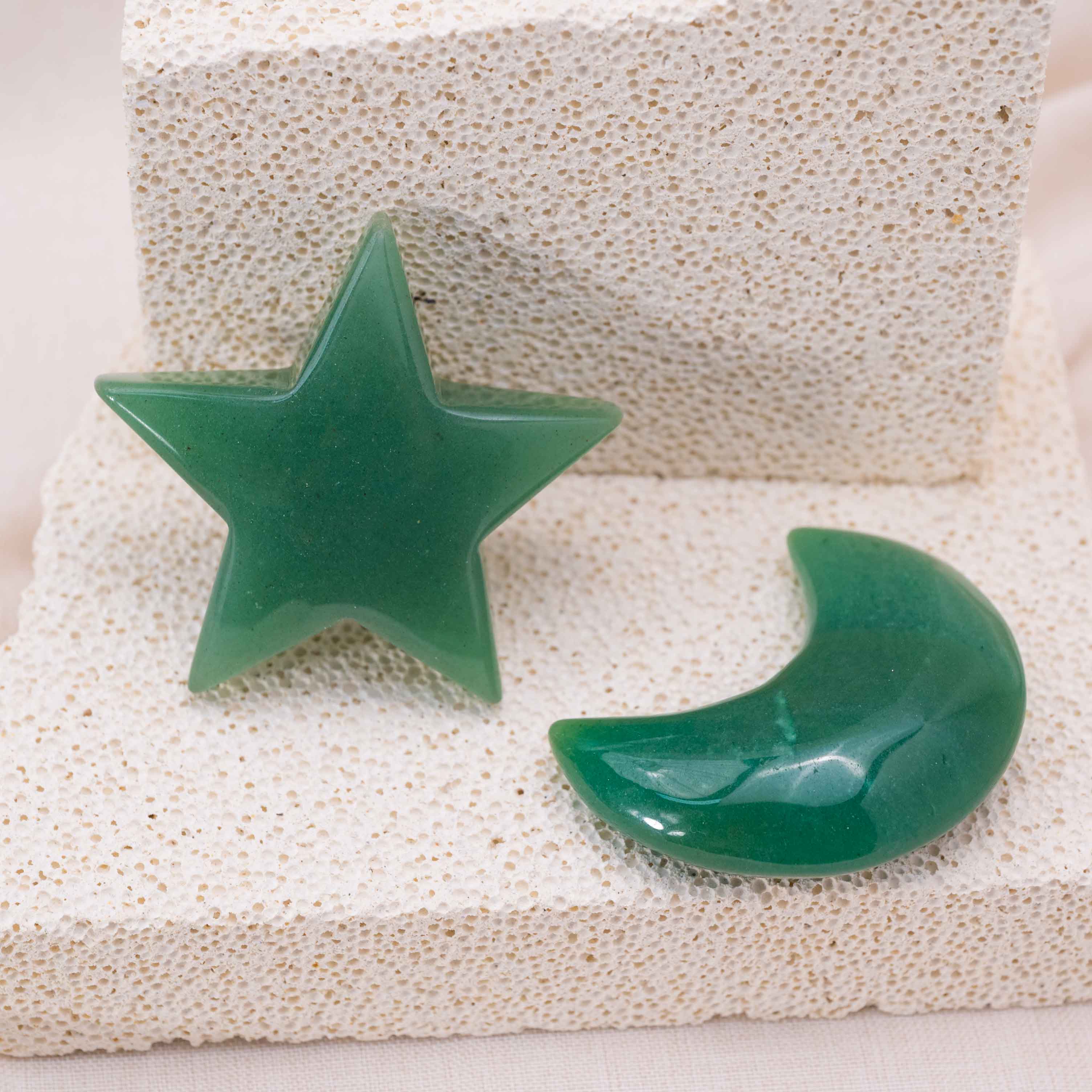 Display of Green Aventurine Star/Moon Palm Stone