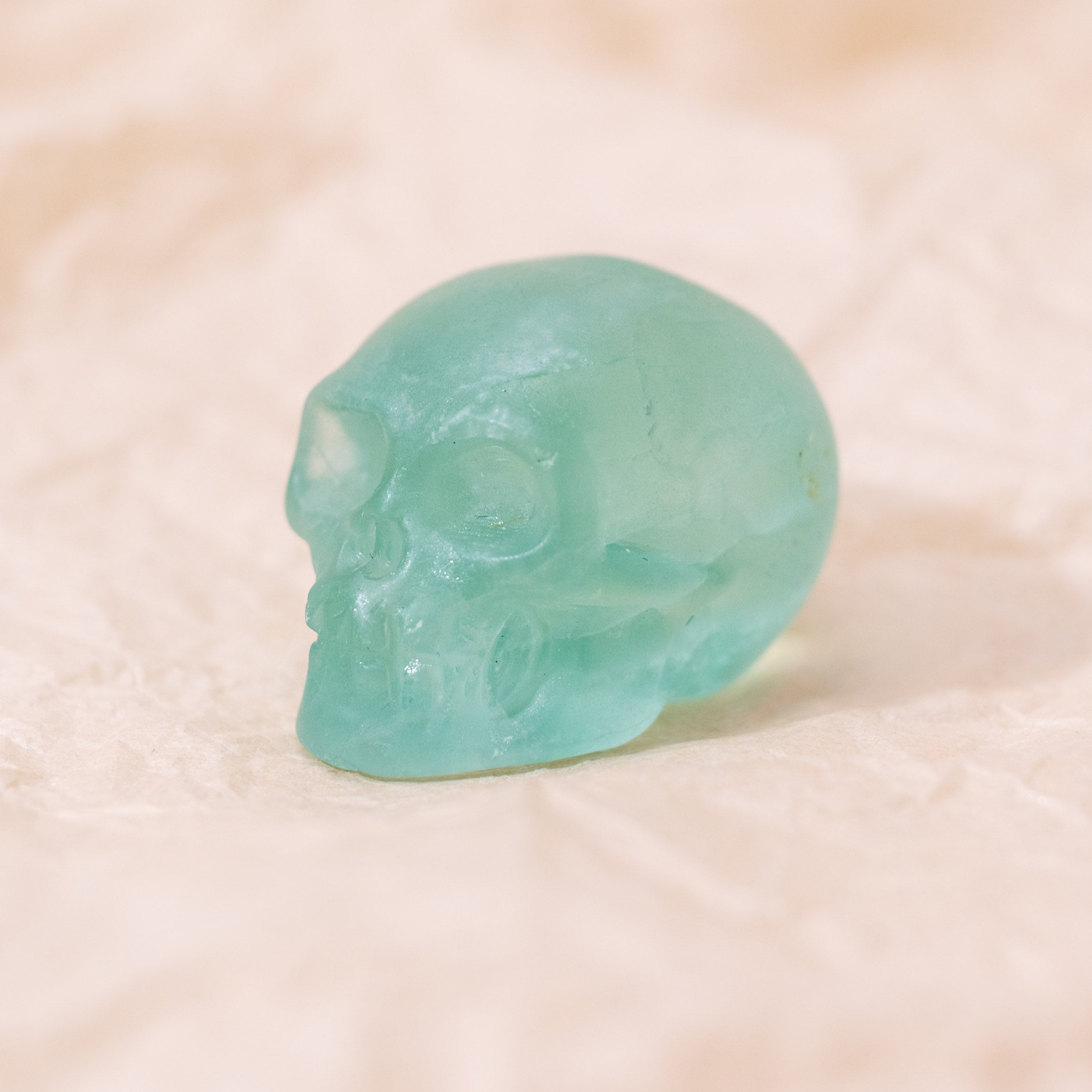 The Green Fluorite Mini Skull promotes healing and harmony, cleansing and stabilizing the aura