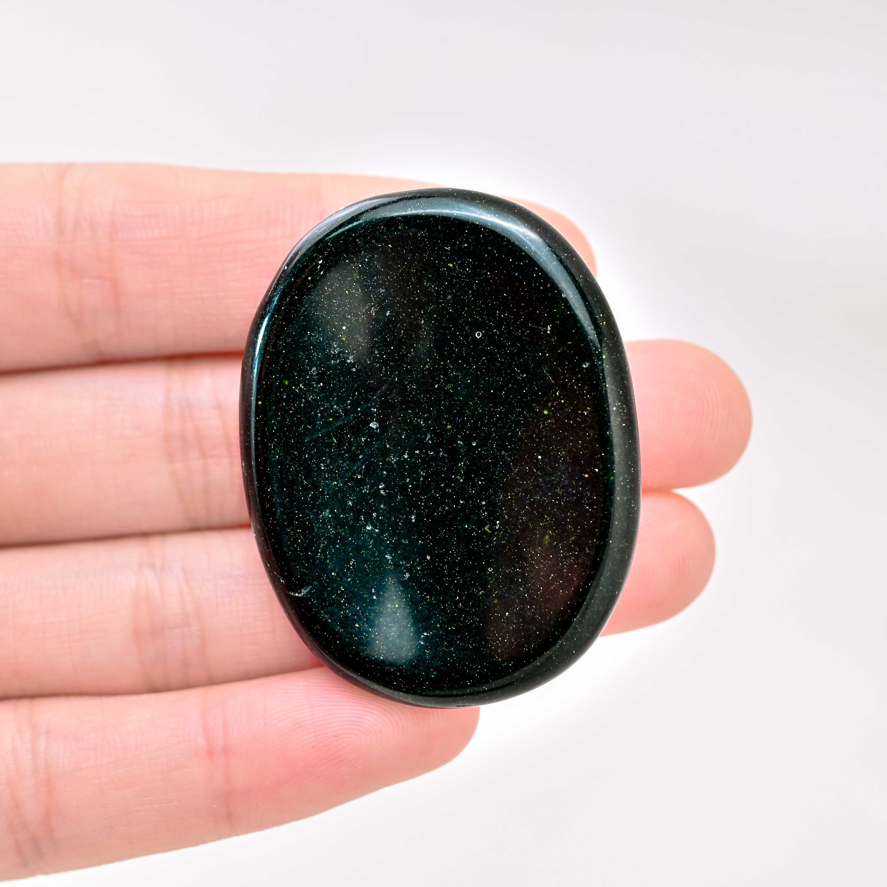 The Green Sand Worry Stone promotes emotional balance and positivity