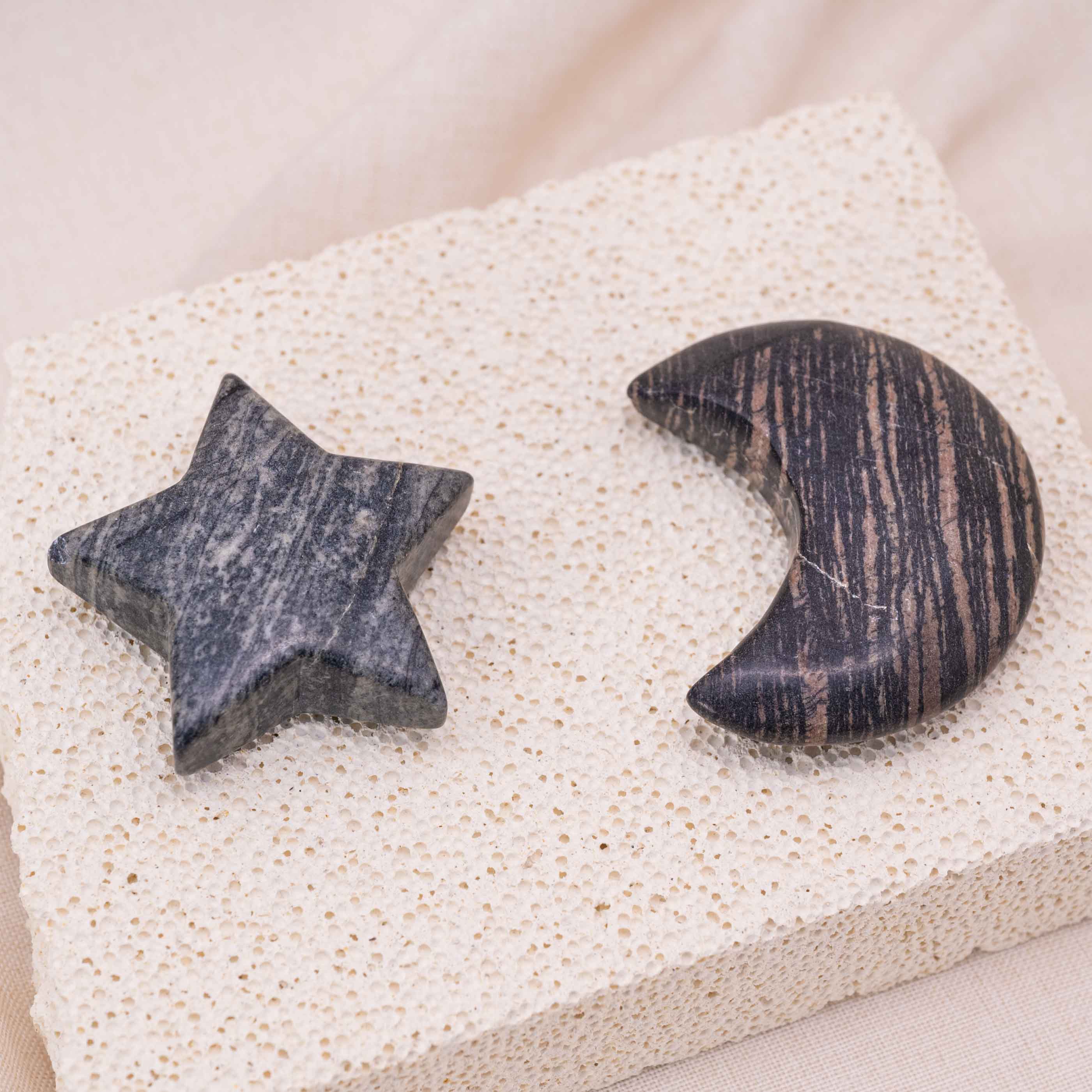 Detailed view of Black Net Stone Star/Moon Palm Stone