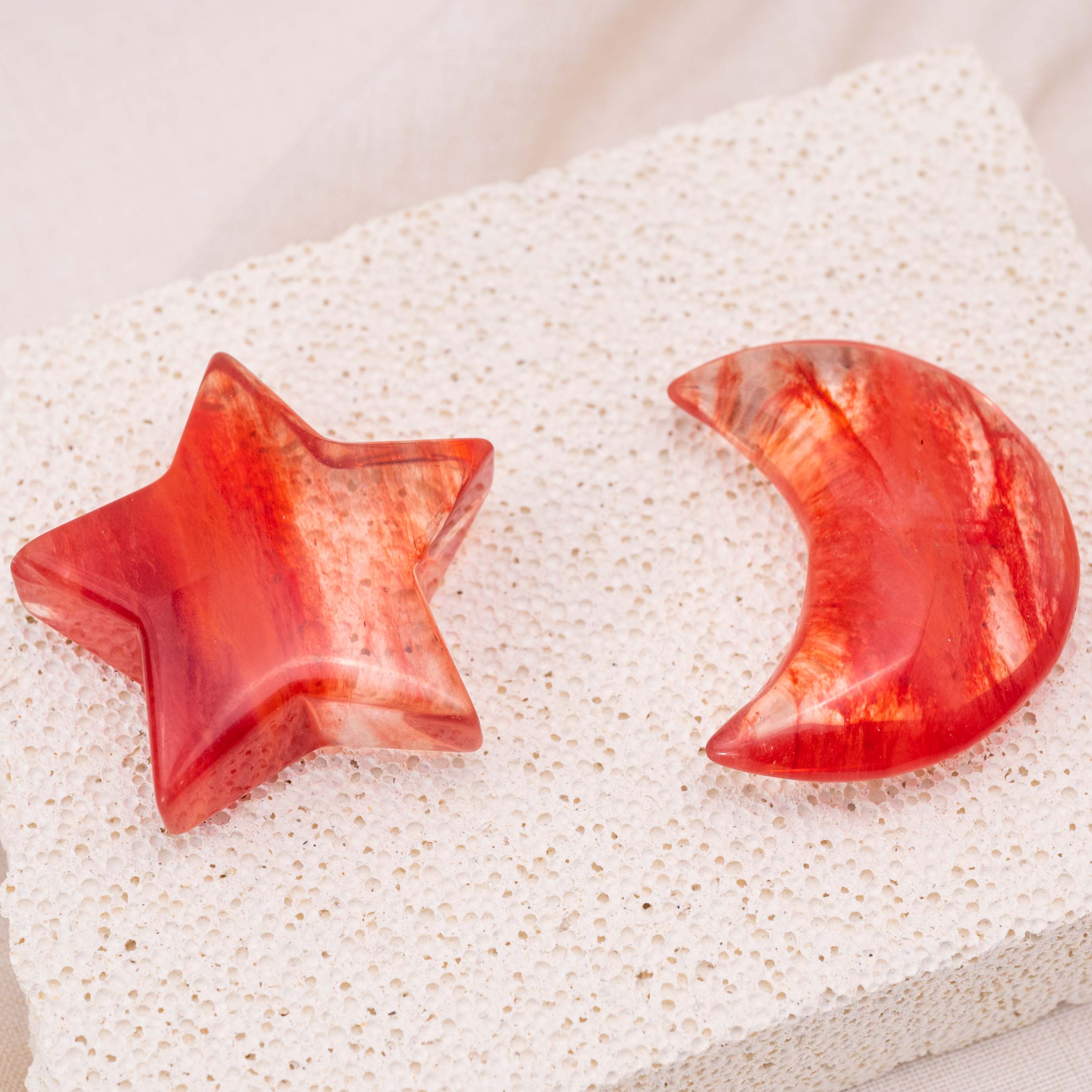 Close-up of Red Smelting Quartz Star/Moon Palm Stone