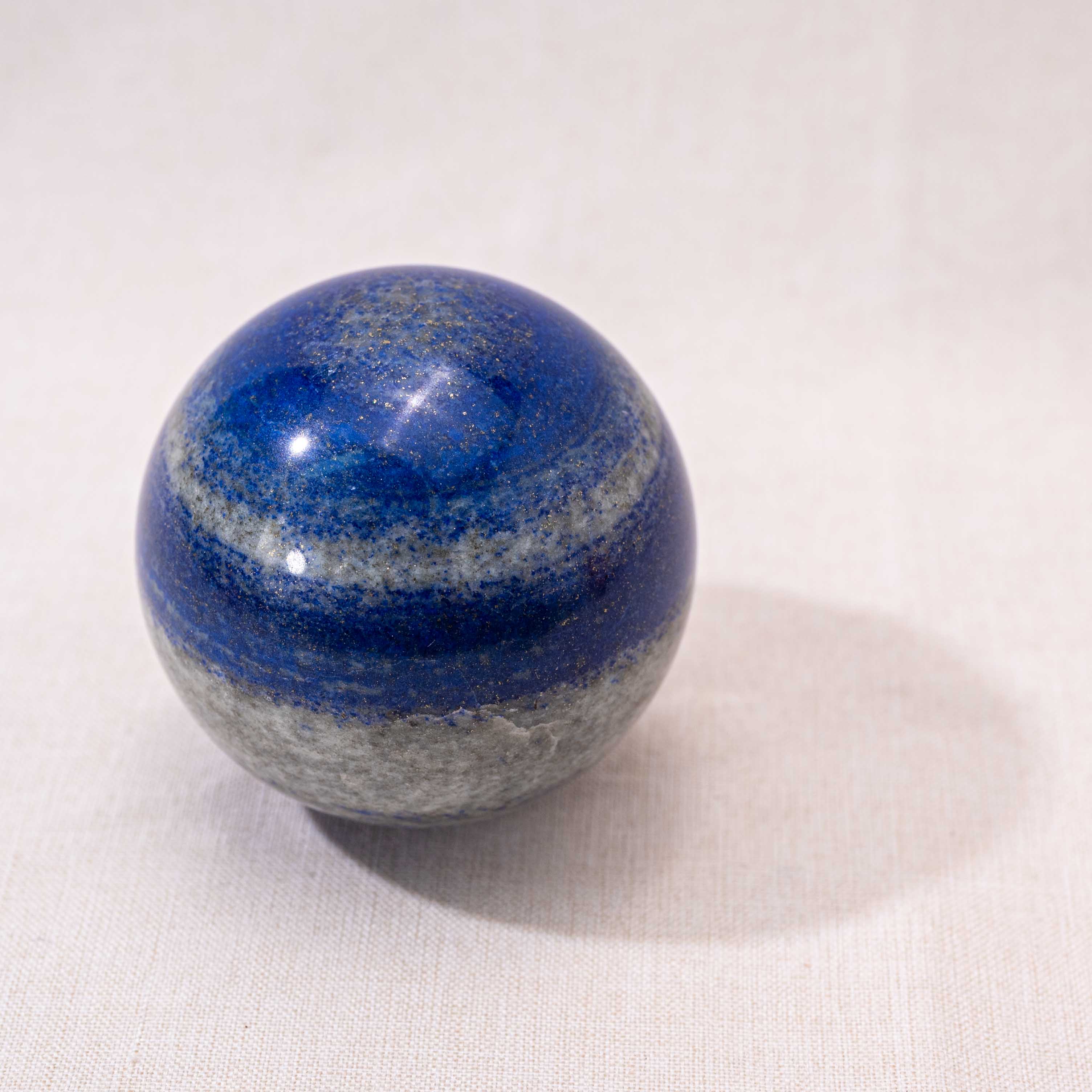Emotional healing lapis lazuli sphere, a stunning piece for enhancing your living space and well-being.