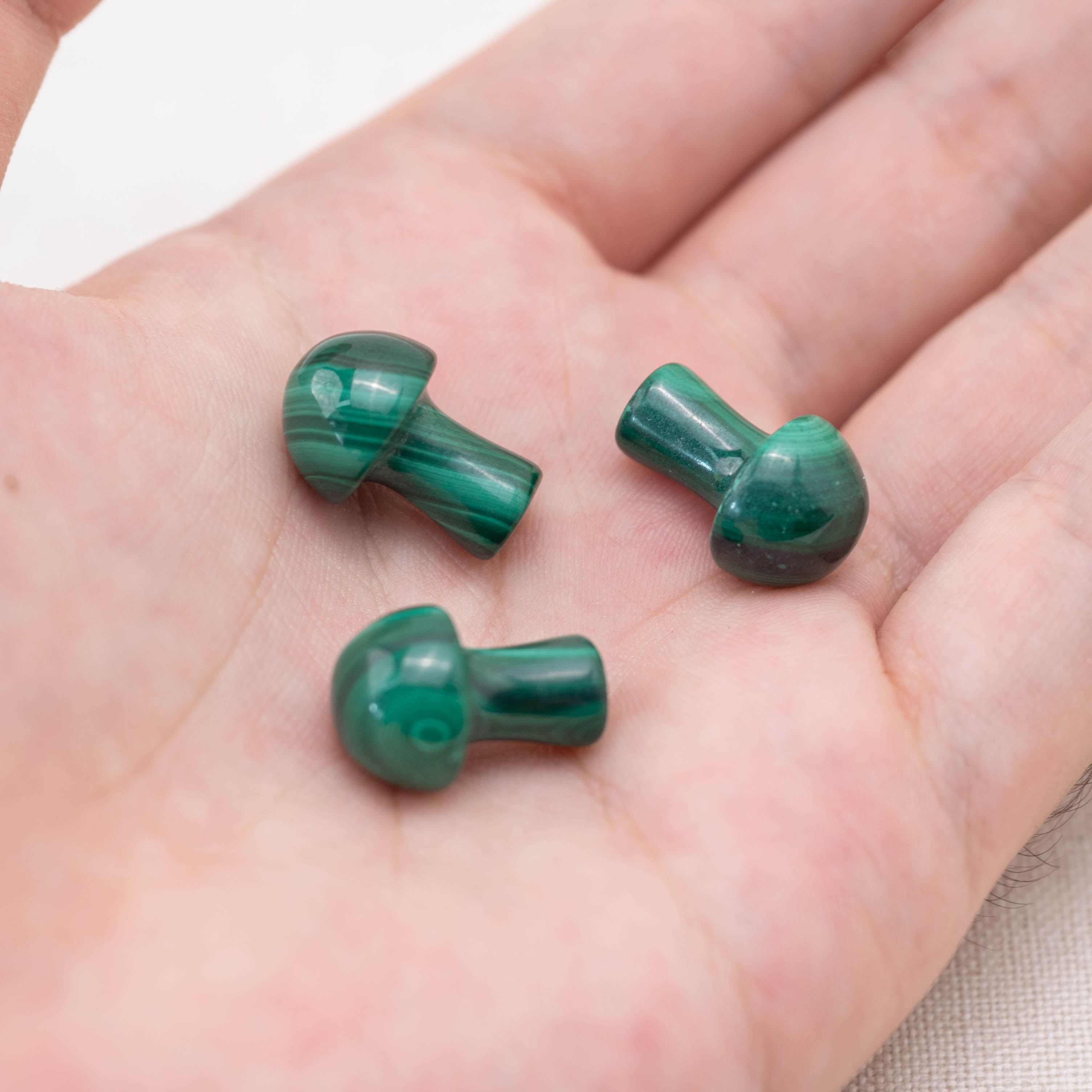 Enhance your home decor with this stunning Malachite Mushroom, a symbol of natural beauty and spiritual wellness.