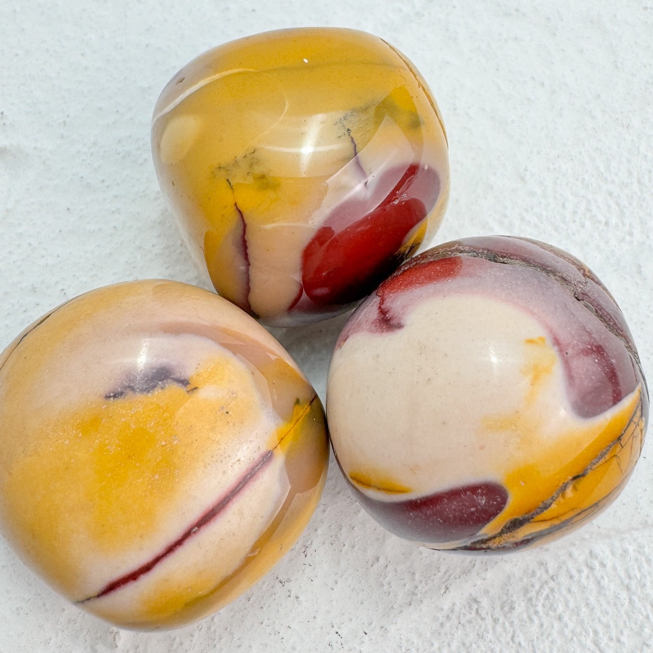 Close-up of vibrant Mookaite Jasper Tumble stones