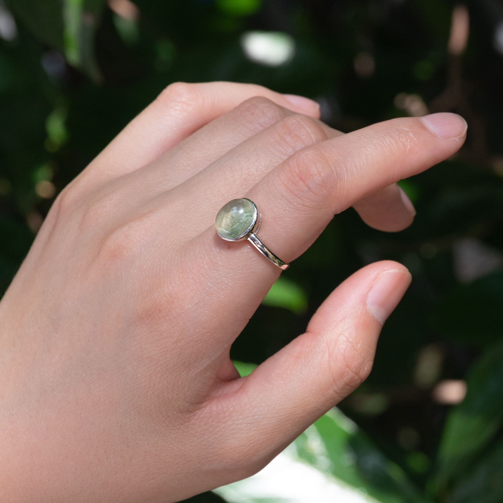 Sleek Prehnite Ring featuring a translucent green prehnite stone.