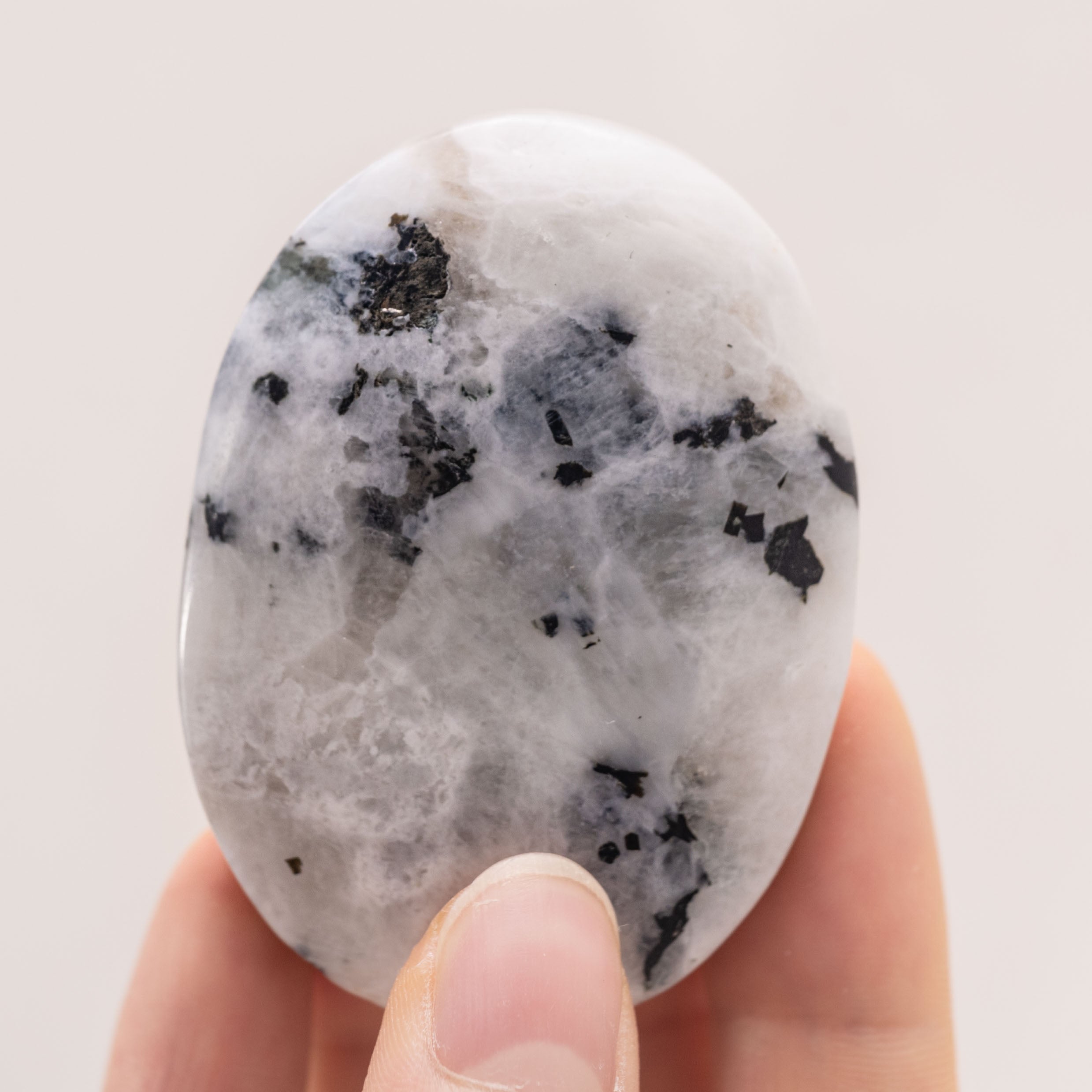 Hand-polished Rainbow Moonstone Palm Stone, perfect for enhancing inner peace