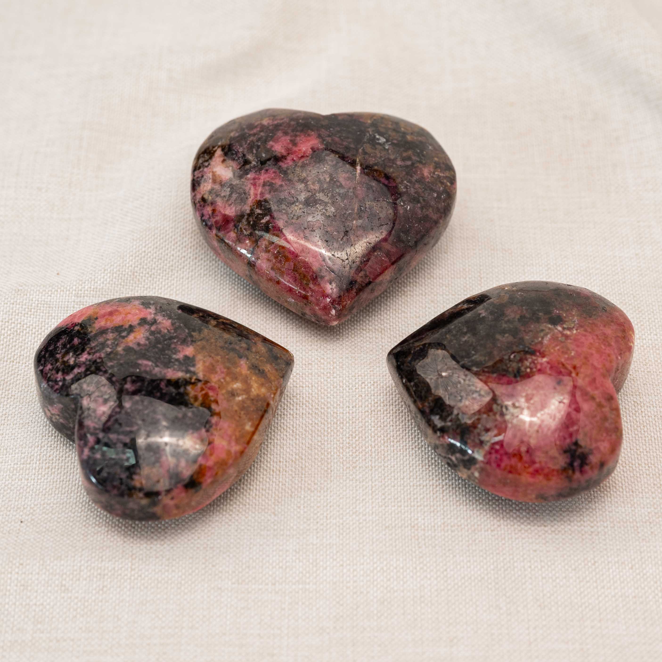 Handcrafted from natural rhodonite, this heart-shaped stone enhances self-love and reduces anxiety.