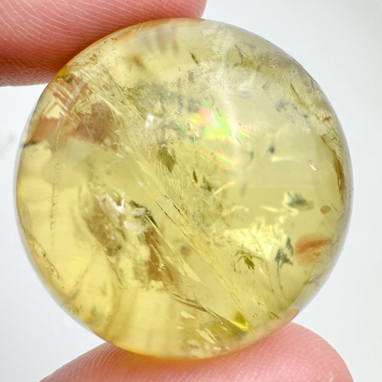 Close-up of a citrine sphere showing glossy surface and clarity