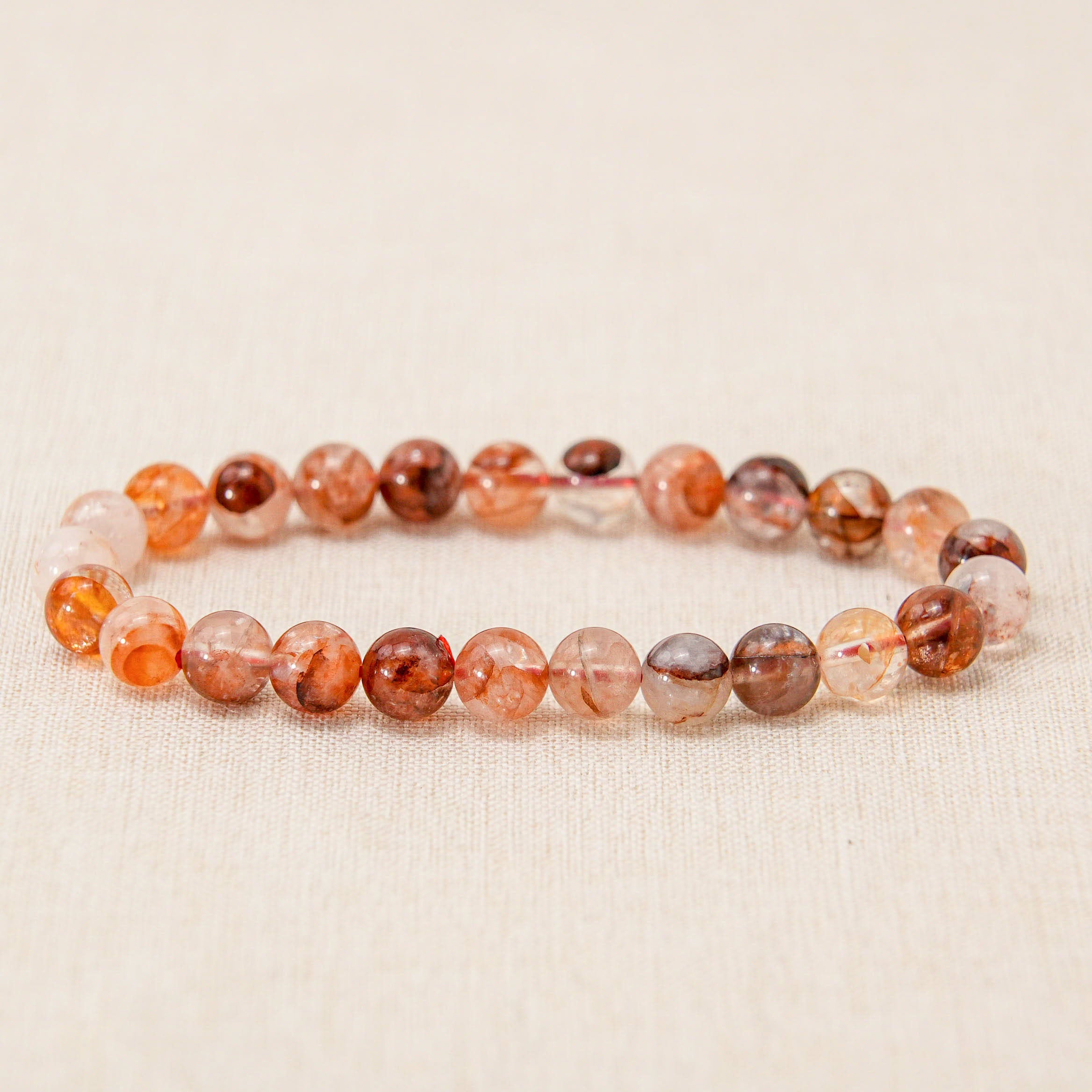 This stunning Red Fire Quartz Bracelet is infused with the powerful energy of the root and sacral chakras