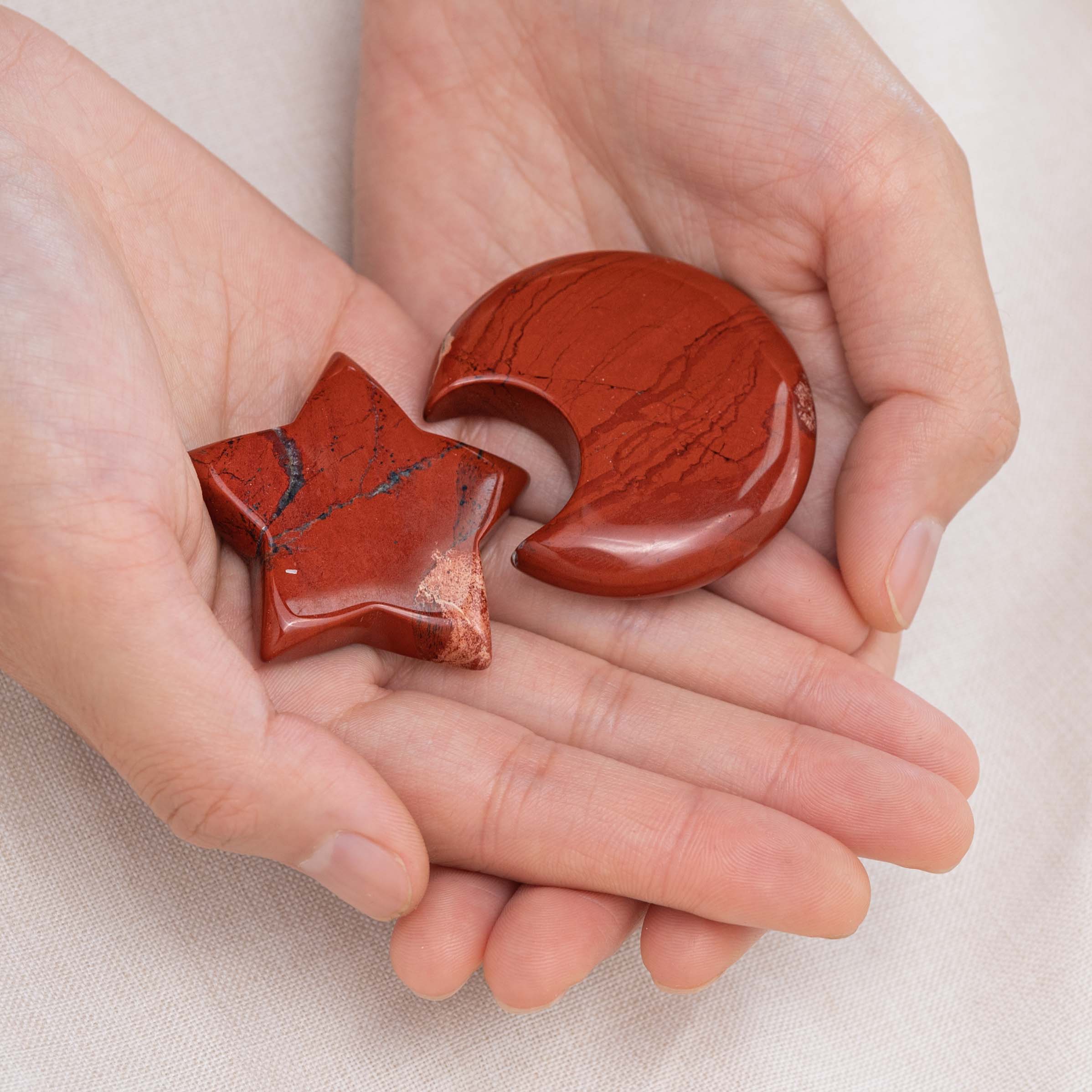 Red Jasper Star/Moon Palm Stone held in hand