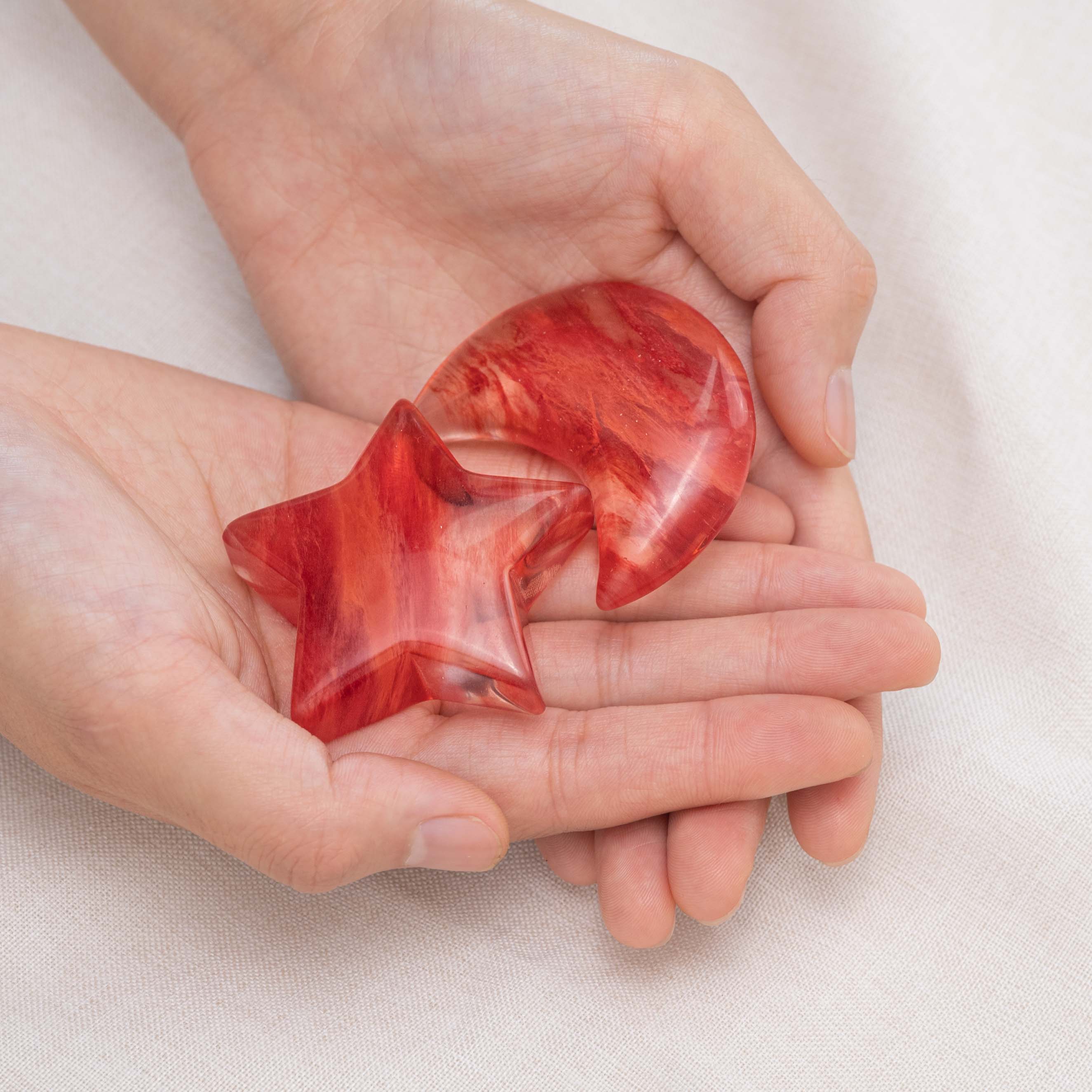 Red Smelting Quartz Star/Moon Palm Stone held in hand