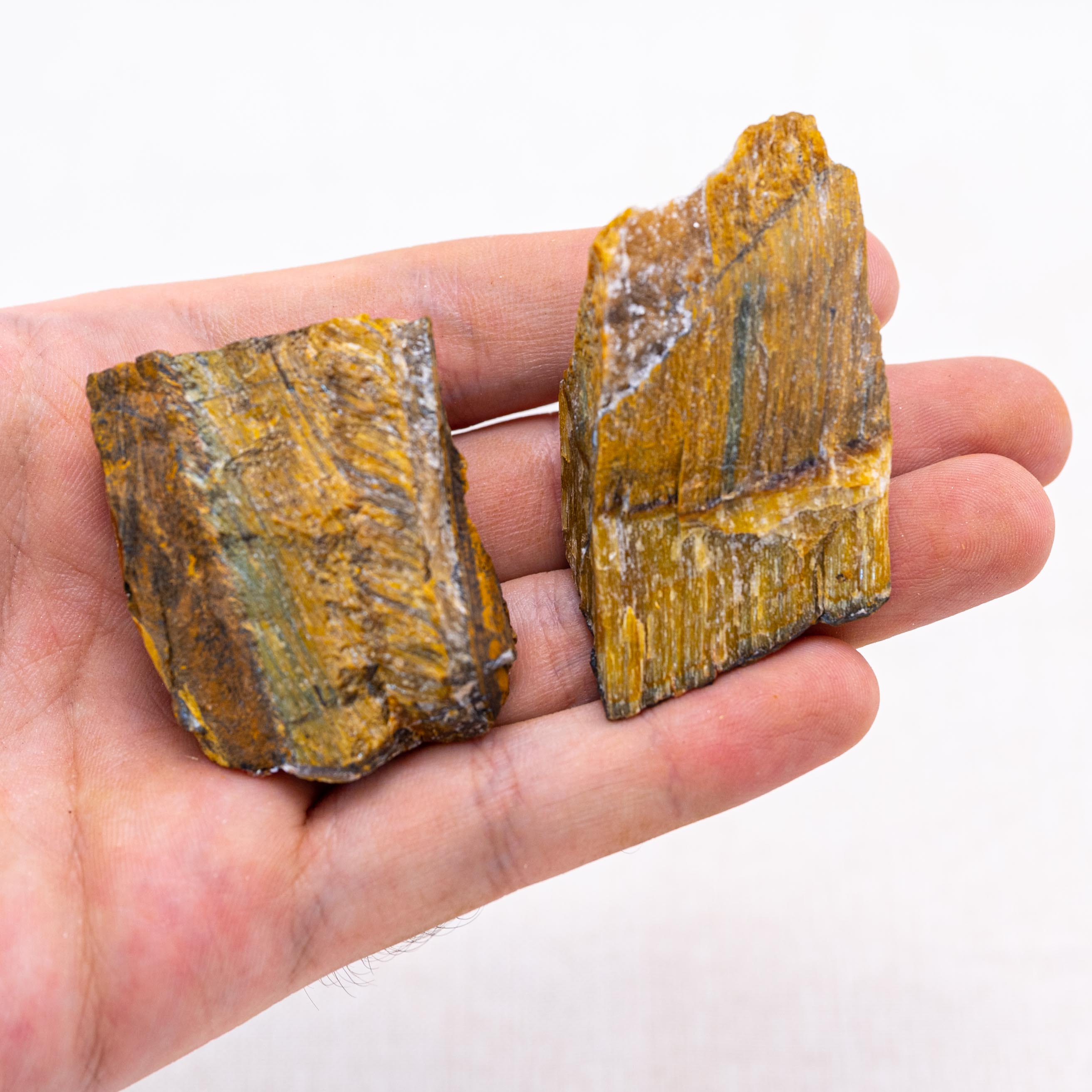 Unpolished tiger eye stones are great for grounding energy