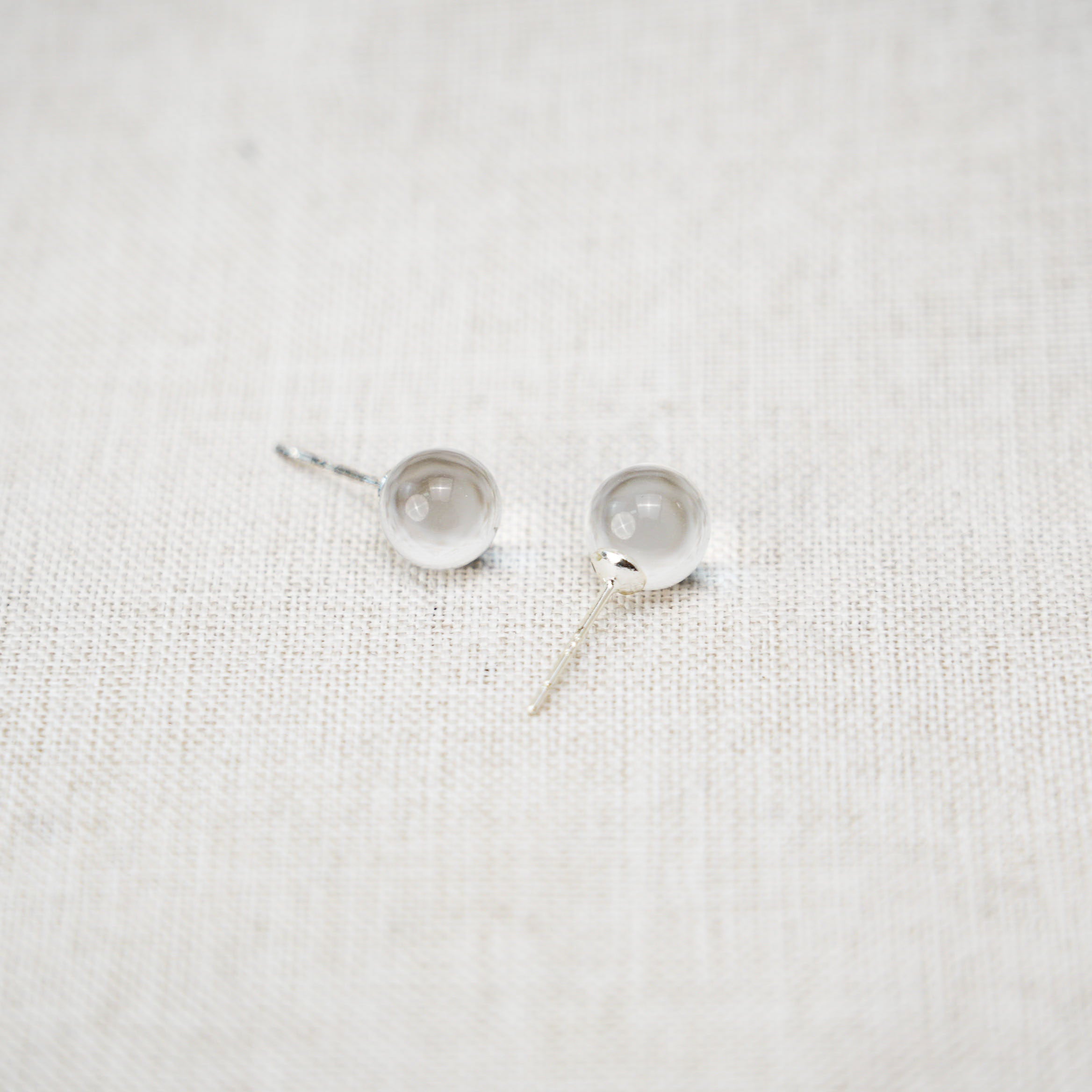 Trendy clear quartz hoop earrings that combine modern design with natural beauty.