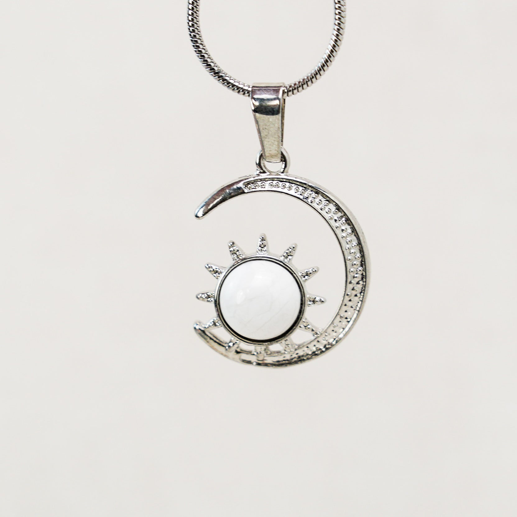 Luxurious moon pendant with gold-plated accents, perfect for gifting or personal use.