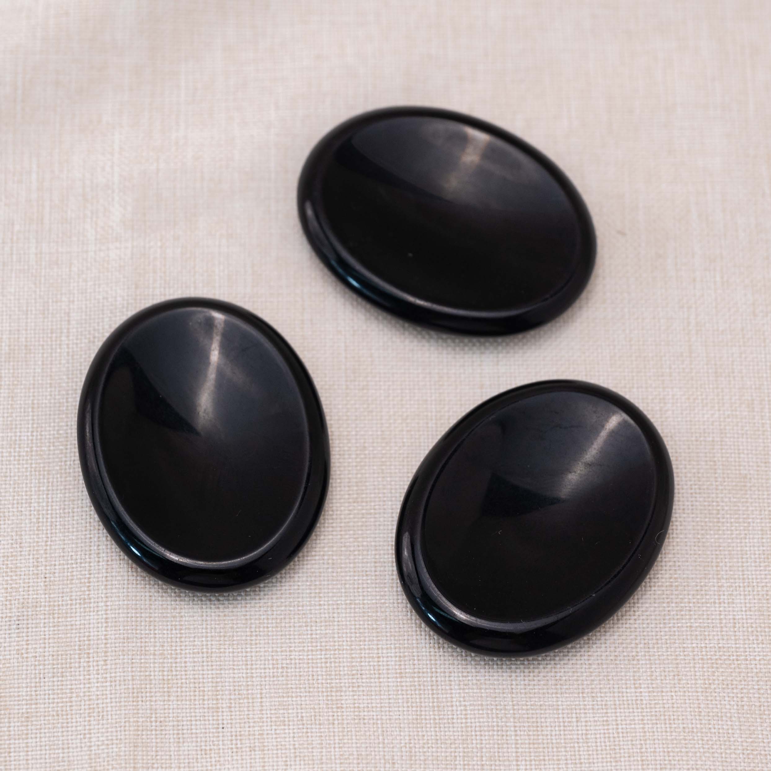 Experience the grounding energy of the Black Obsidian Worry Stone throughout the day