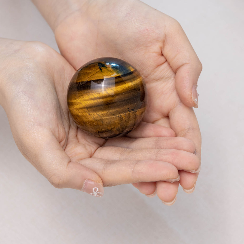 Blue Tiger Eye Stone Sphere with reflective blue tones