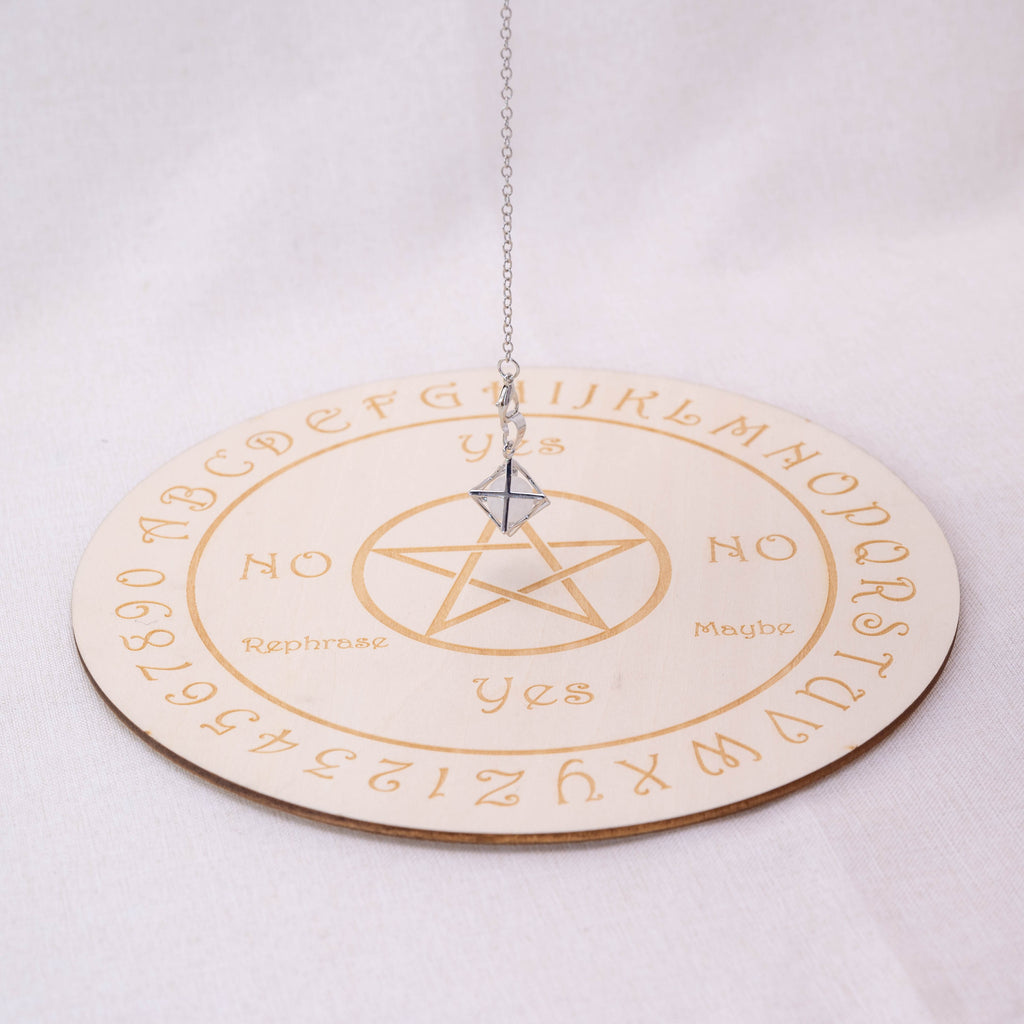 Detailed view of Clear Quartz Merkaba-shaped pendulum