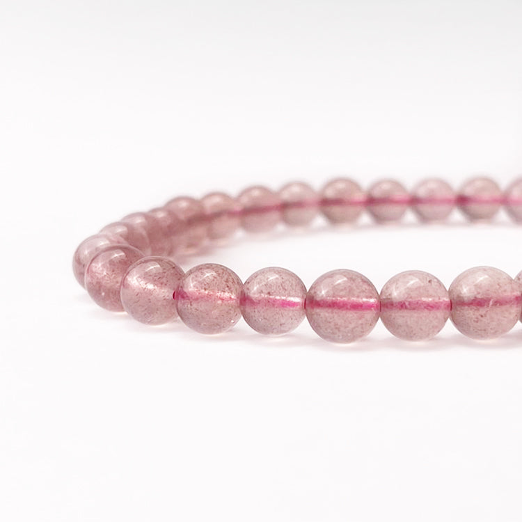 Natural Strawberry Quartz Bracelet with warm, pinkish-red hues