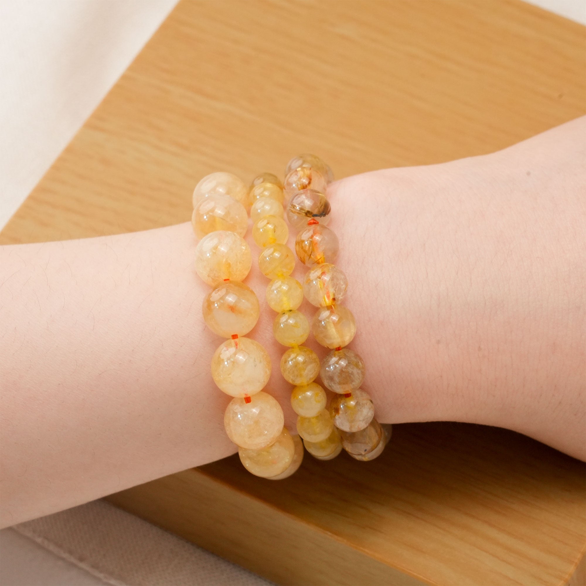 Golden Rutile Quartz crystal bracelet showcasing intricate golden threads, perfect for attracting success and prosperity