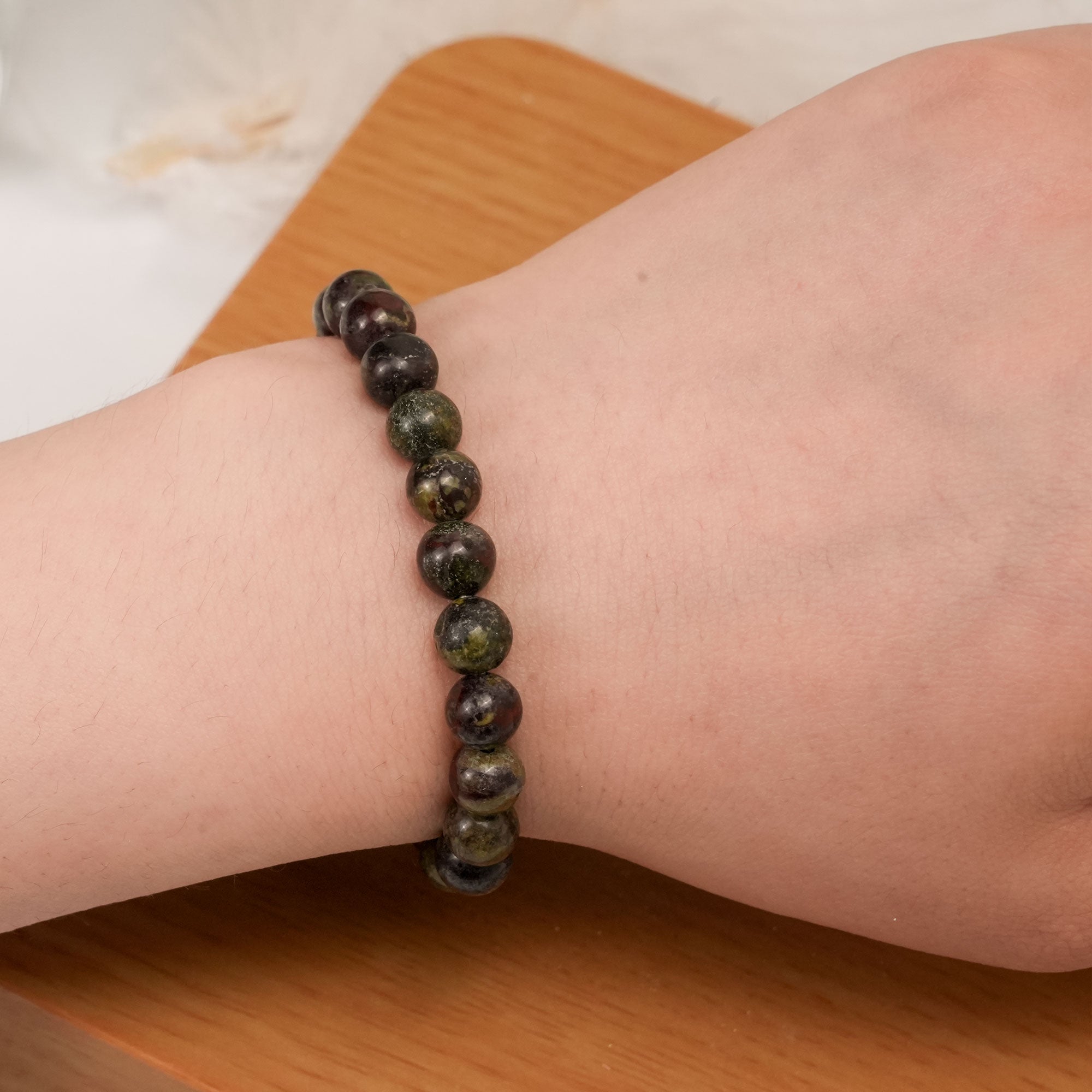 Natural Dragon Blood Stone Bracelet with vibrant hues, ideal for boosting courage and confidence