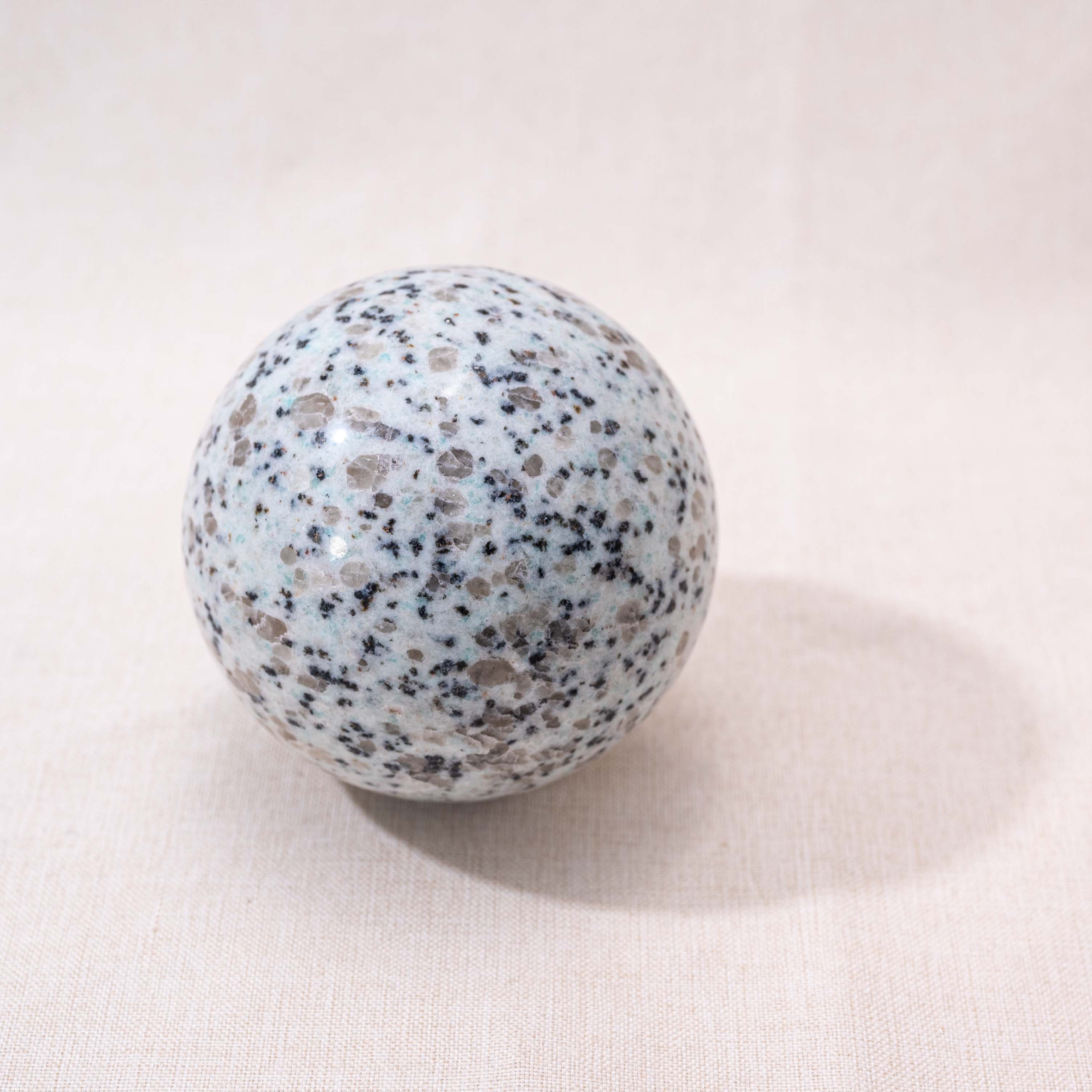 Kiwi Jasper Sphere, a versatile crystal for meditation and relaxation.