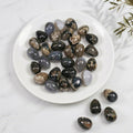 Natural UV Reactive Black Volcanic Agate Egg Tumbled Stone, Polished Fluorescent Volcanic Agate Palm Worry Stone for Meditation Altar Crystal Decor Gift