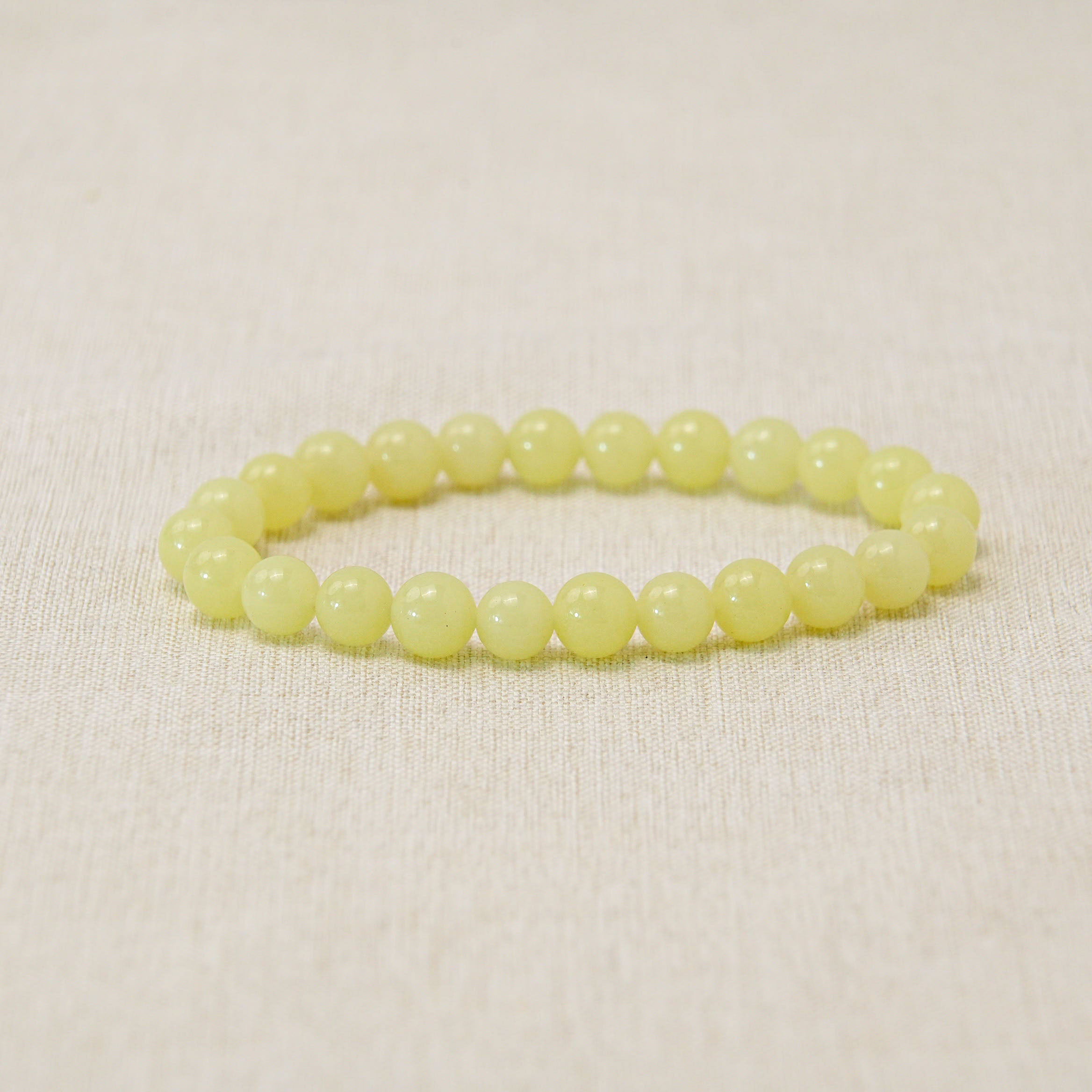 Ethereal luminous stone bracelet that shines brightly, promoting positivity and inner peace.