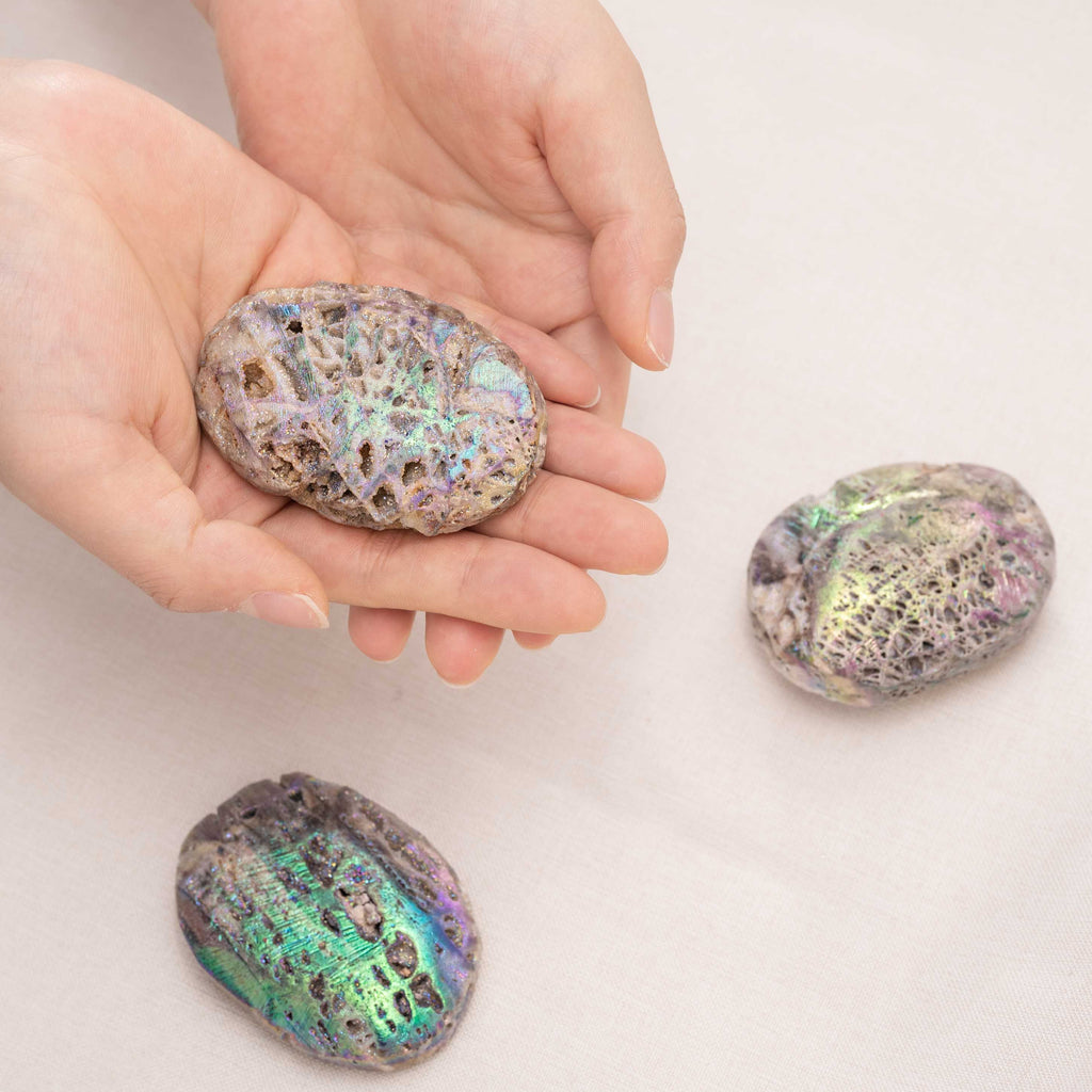 Aura Sphalerite crystal palm stone displaying its brilliant spectral colors